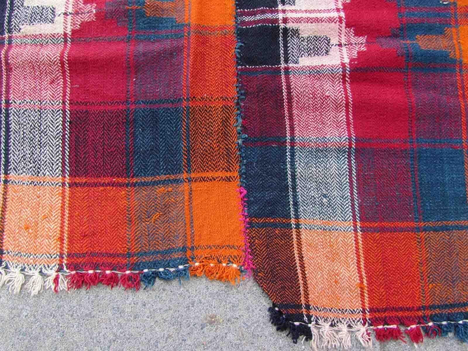 Handmade vintage Moj kilim in colorful shades made in stripes. The Moj is made as a throw, usually made from two or few narrower piece, nearly identical (you able to undo the joint in middle and use it as a curtain) one of the panel is shorter than