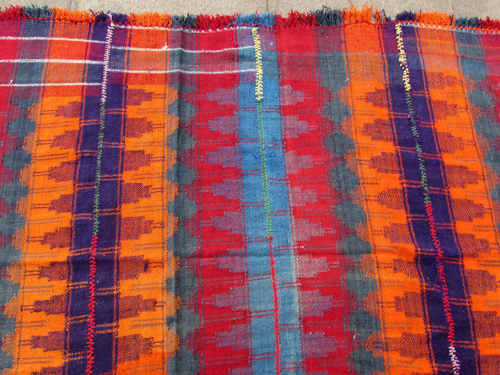 Handmade vintage Mojj throw. It is in original good condition, made out of narrow blankets. 

-Condition: Original good,

-circa 1960s,

-Size: 5.7' x 5.11' (168cm x 177cm),

-Material: Wool,

-Country of origin: Middle East,

-Style: