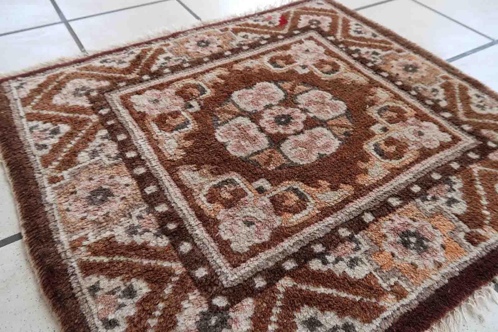 Handmade vintage Mongolian collectible mat in brown shade. The rug is from the middle of 20th century in original good condition.

-condition: original good,

-circa: 1950s,

-size: 1.7' x 1.9' (52cm x 60cm),

-material: wool,

-country of origin: