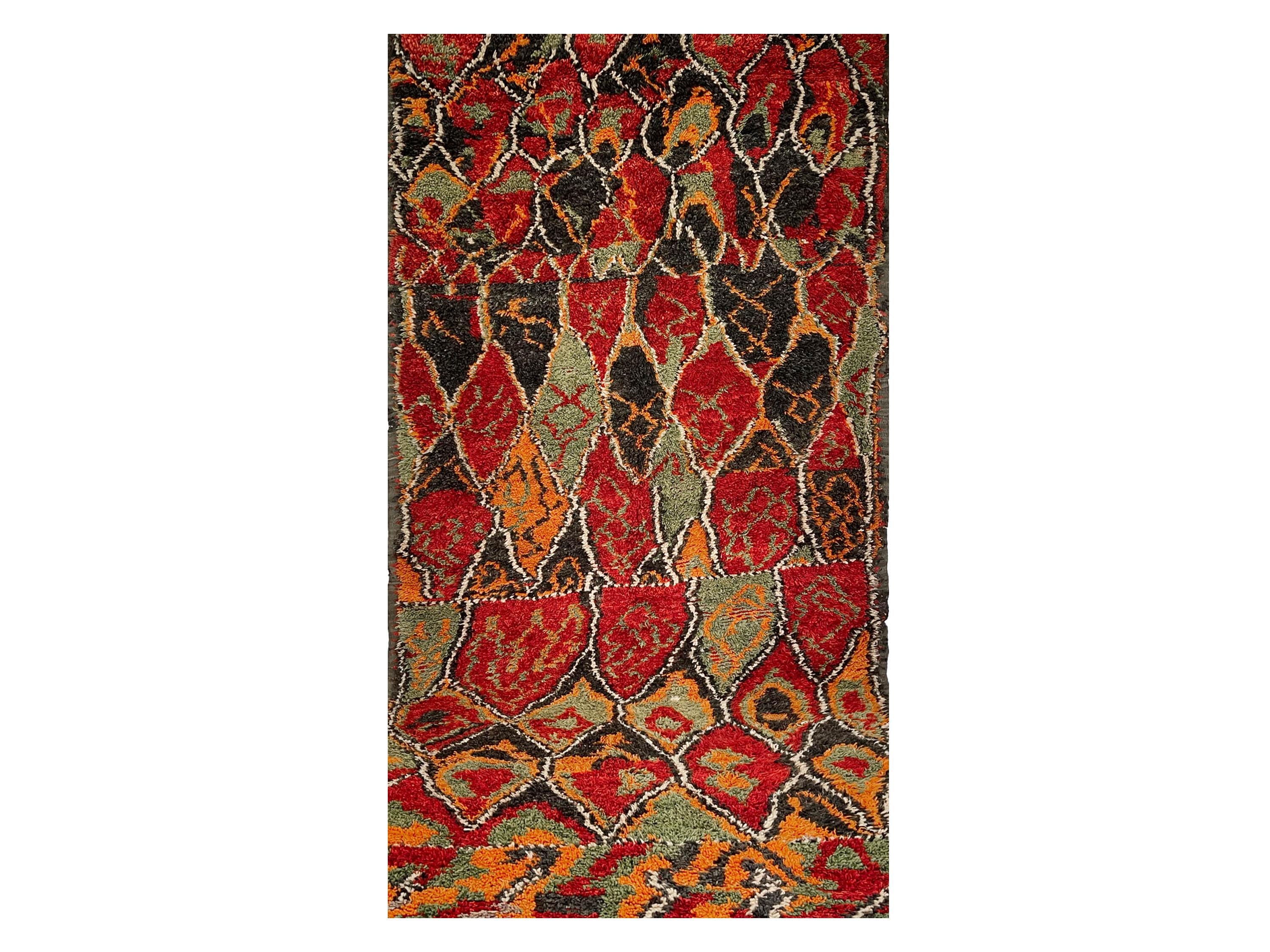 Presenting a captivating array of diamond patterns combined with crisp hues of red and orange, this carpet awes any viewer with unique designs representing a vintage Moroccan culture. 

“The Fruit” creates an irresistible charm with its creative