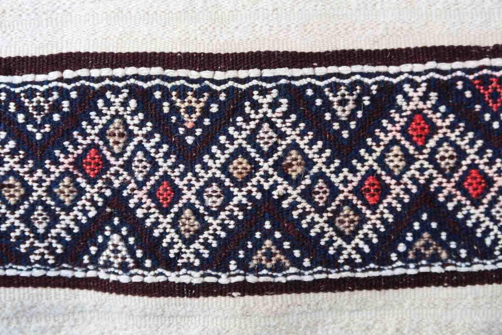 Handmade vintage Moroccan woolen kilim in stripes. This flatweave is from the middle of 20th century in original good condition.

-condition: original good,

-circa: 1950s,

-size: 3.8' x 6.8' (118cm x 210cm),

-material: wool,

-country