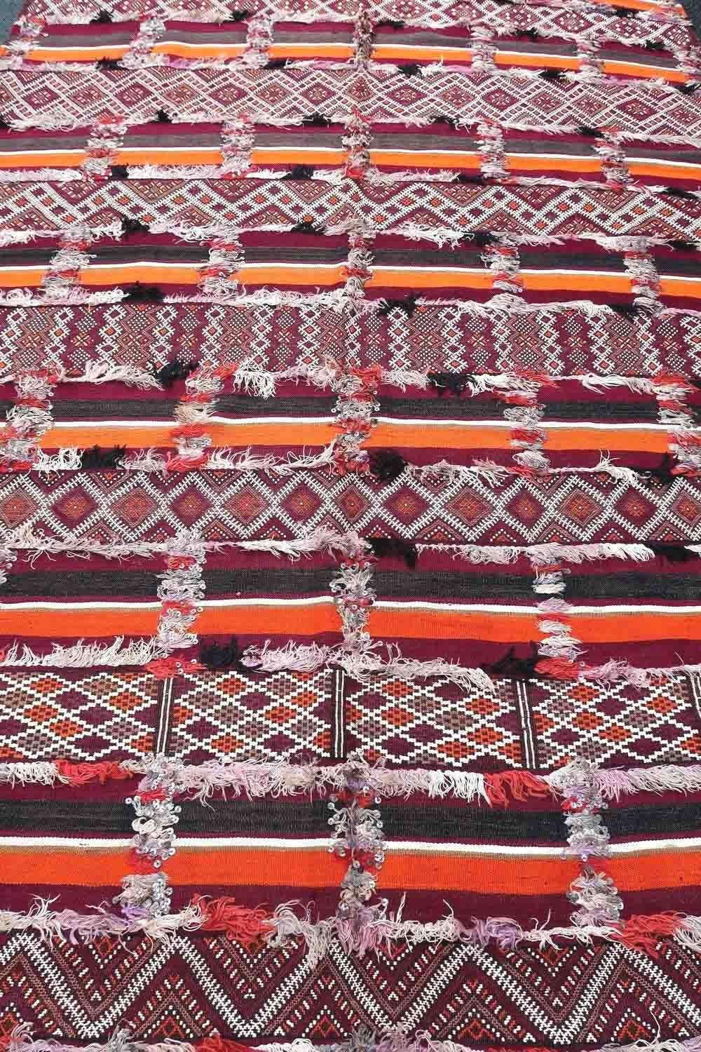 Handmade vintage Moroccan Berber kilim in colorful shades. The rug is from the middle of 20th century in original good condition.

-condition: original good,

-circa: 1950s,

-size: 5.4' x 10.8' (165cm x 332cm),

-material: wool,

-country