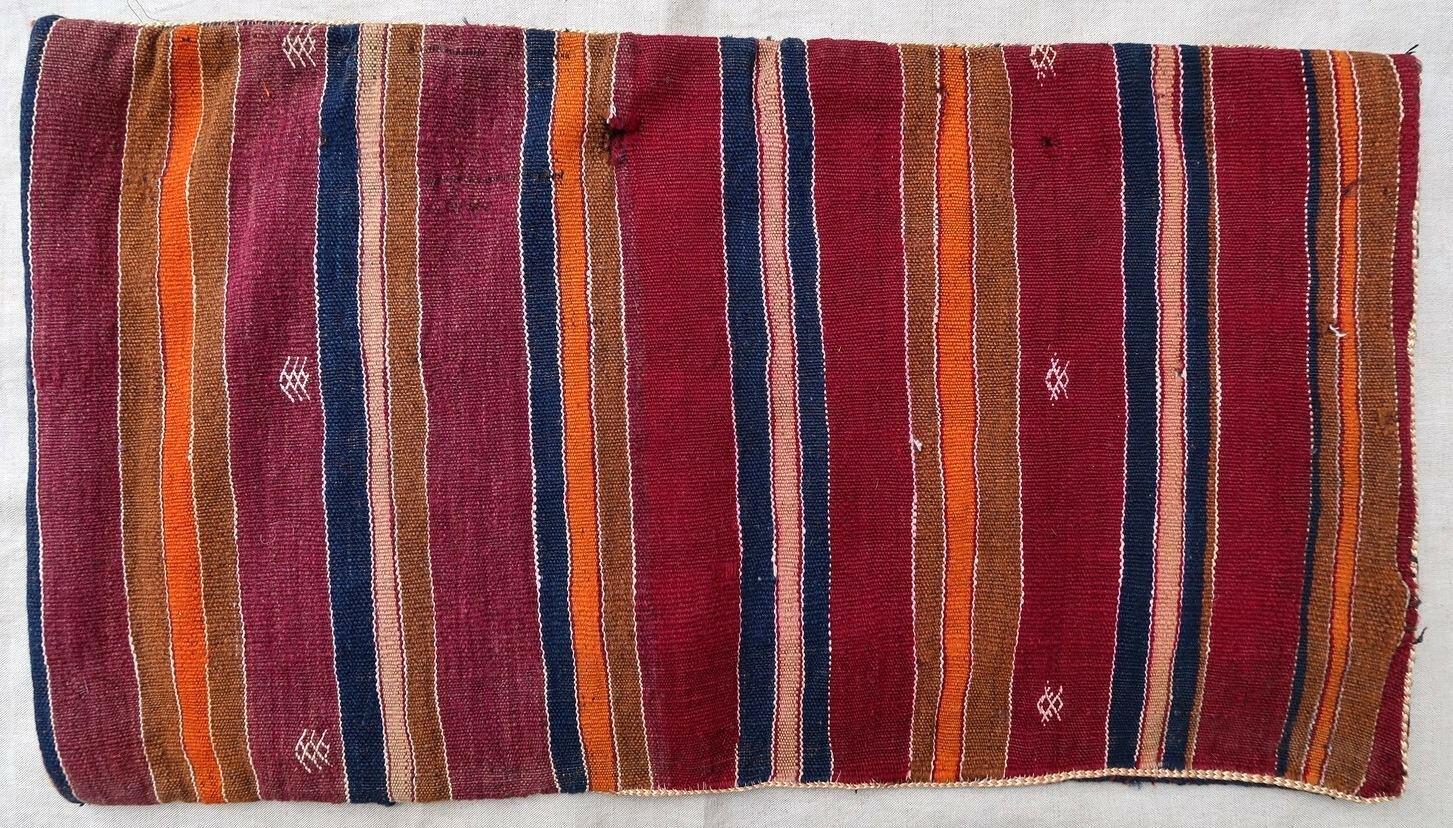 Handmade vintage Moroccan Berber cushion made out of vintage Kilim. The flat-weave is from the middle of 20th century, it is in original good condition. 

- Condition: original good,

- circa 1950s,

- Size: 1.3' x 2.4' (41cm x 73cm),

-