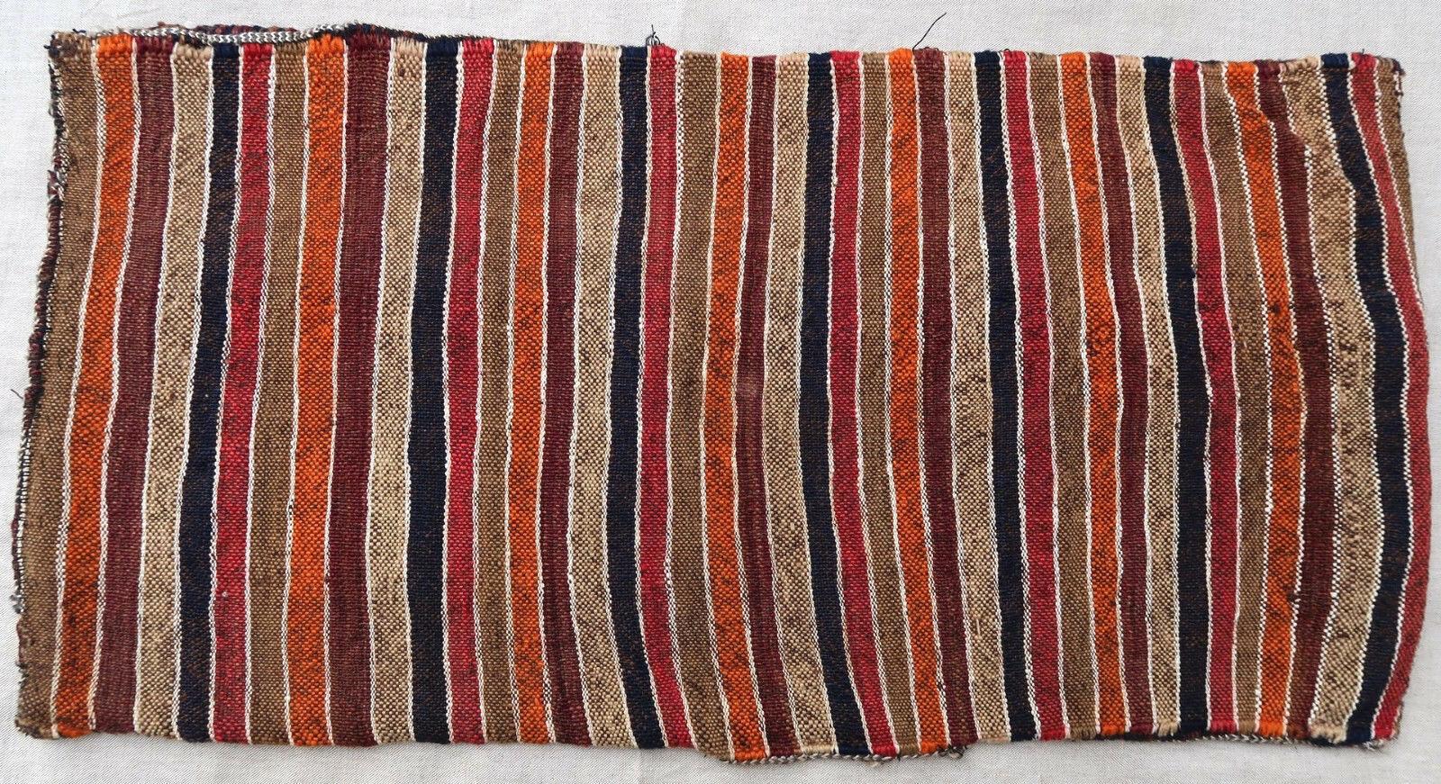Handmade vintage Moroccan Berber cushion made out of vintage Kilim. The flat-weave is from the mid-20th century, it is in original good condition. 

- Condition: Original good,

- circa 1950s,

- Size: 1.1' x 2.3' (35cm x 70cm),

- Material: