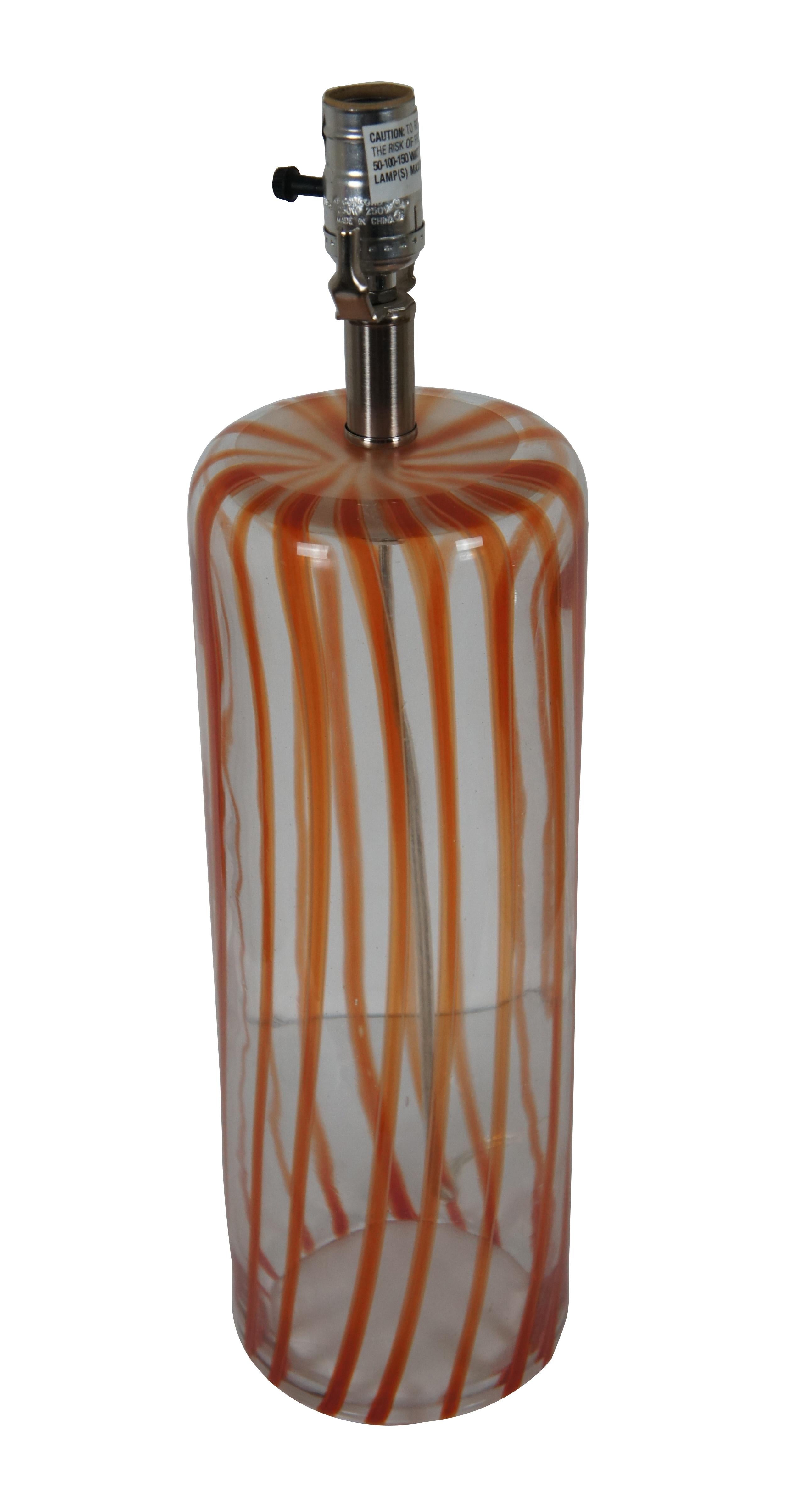 Vintage clear and orange candy stripe art glass hollow base cylindrical table lamp, with clear ball finial.

5.5” x 20.75” / Total Height – 28.5”  (Diameter x Height)