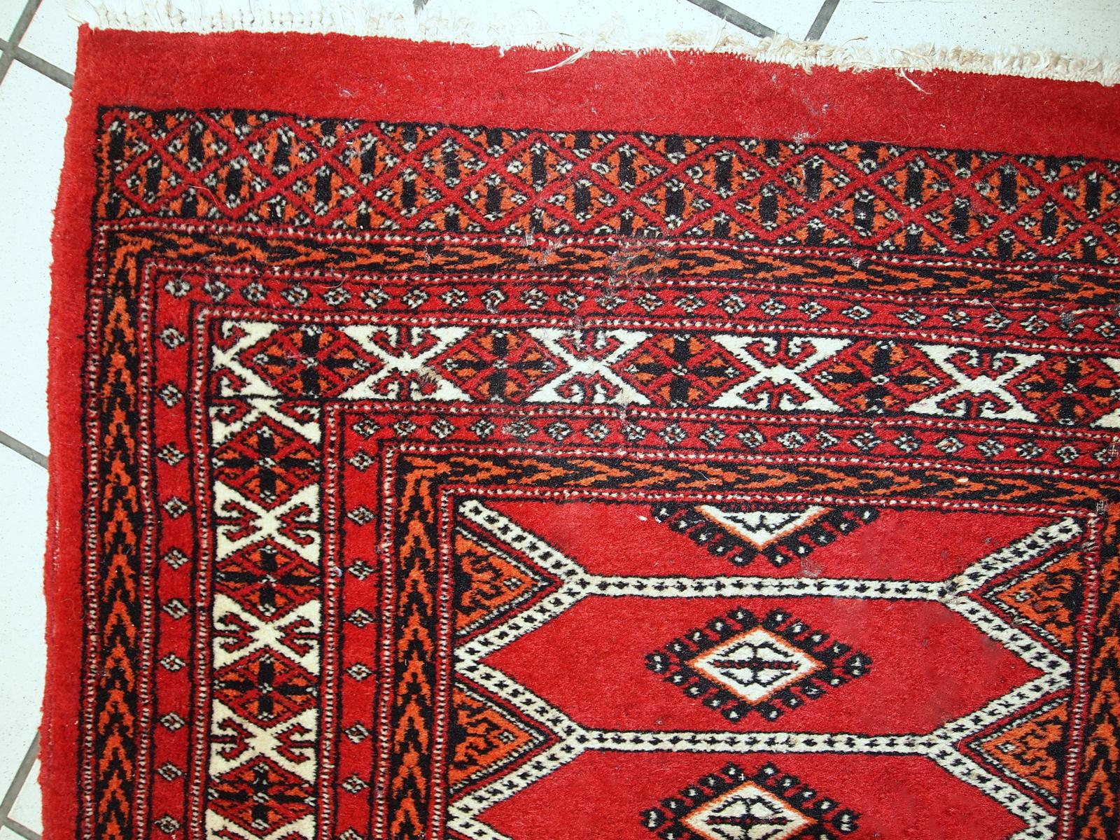 Vintage rug from Pakistan in distressed condition. The rug made in the end of 20th century in red wool.

-condition: distressed,

-circa: 1960s,

-size: 2.6' x 4.7' (81cm x 145cm),

-material: wool,

-country of origin:
