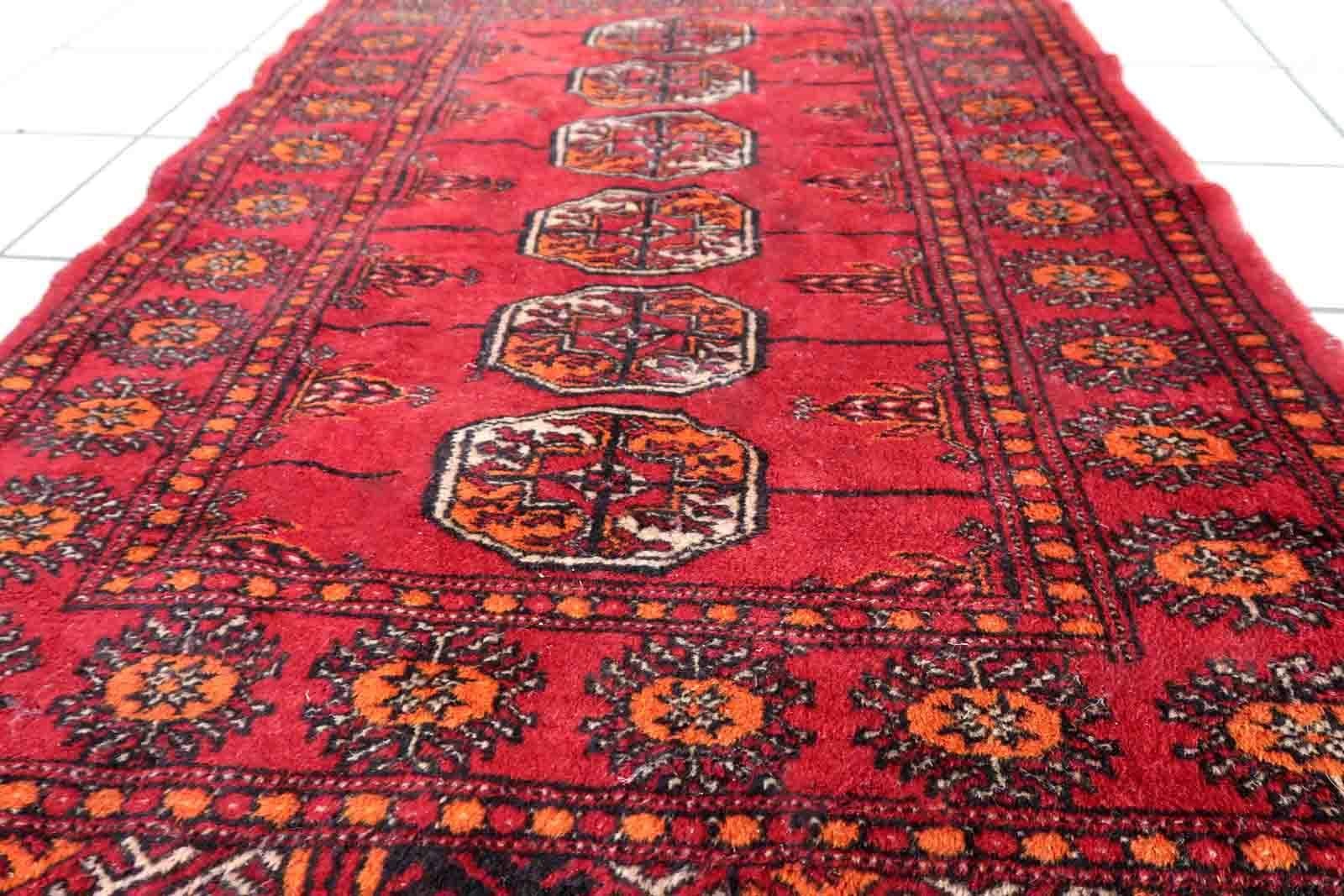 Handmade vintage Pakistani Lahore rug in bright red color. The rug is from the end of 20th century in original condition, it has some low pile. The rug made in traditional design. The rug is thin.

-condition: original, some low pile,

-circa: