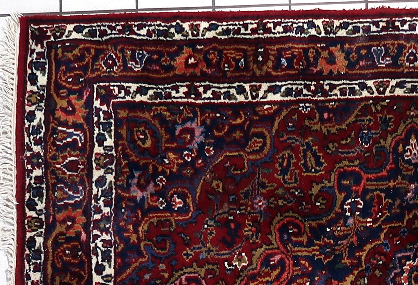 This stunning handmade vintage Persian Hamadan rug is a true masterpiece of traditional craftsmanship. Measuring 4.82 feet by 6.66 feet (147 cm x 203 cm), this exquisite wool rug is in good condition and ready to enhance any living space with its