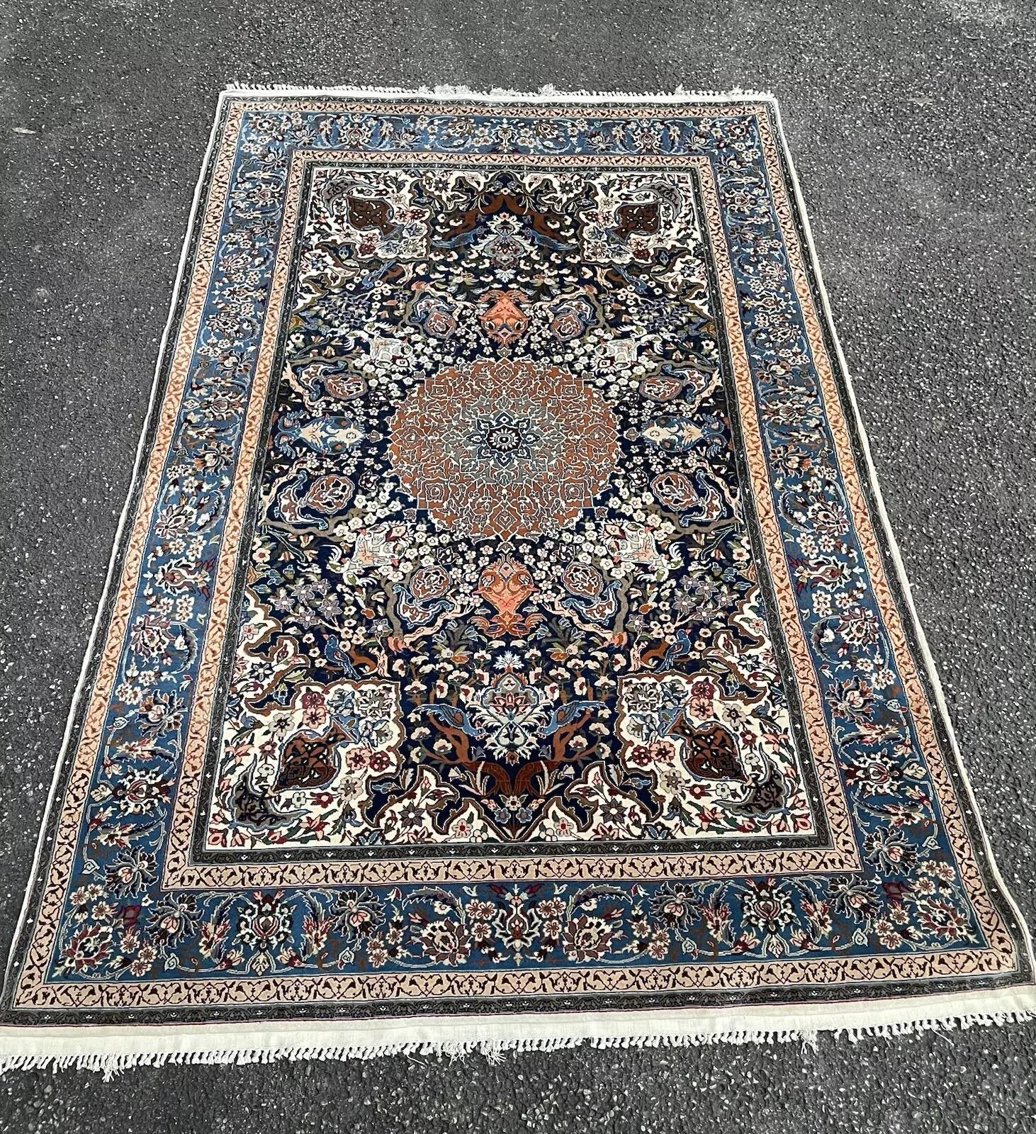 Exquisite Artistry: Vintage Handmade Persian Isfahan Wool & Silk Rug with Birds
Immerse yourself in the pinnacle of Persian rug weaving with this exquisite handmade vintage Isfahan rug, masterfully crafted in Persia around the 1960s. Isfahan rugs