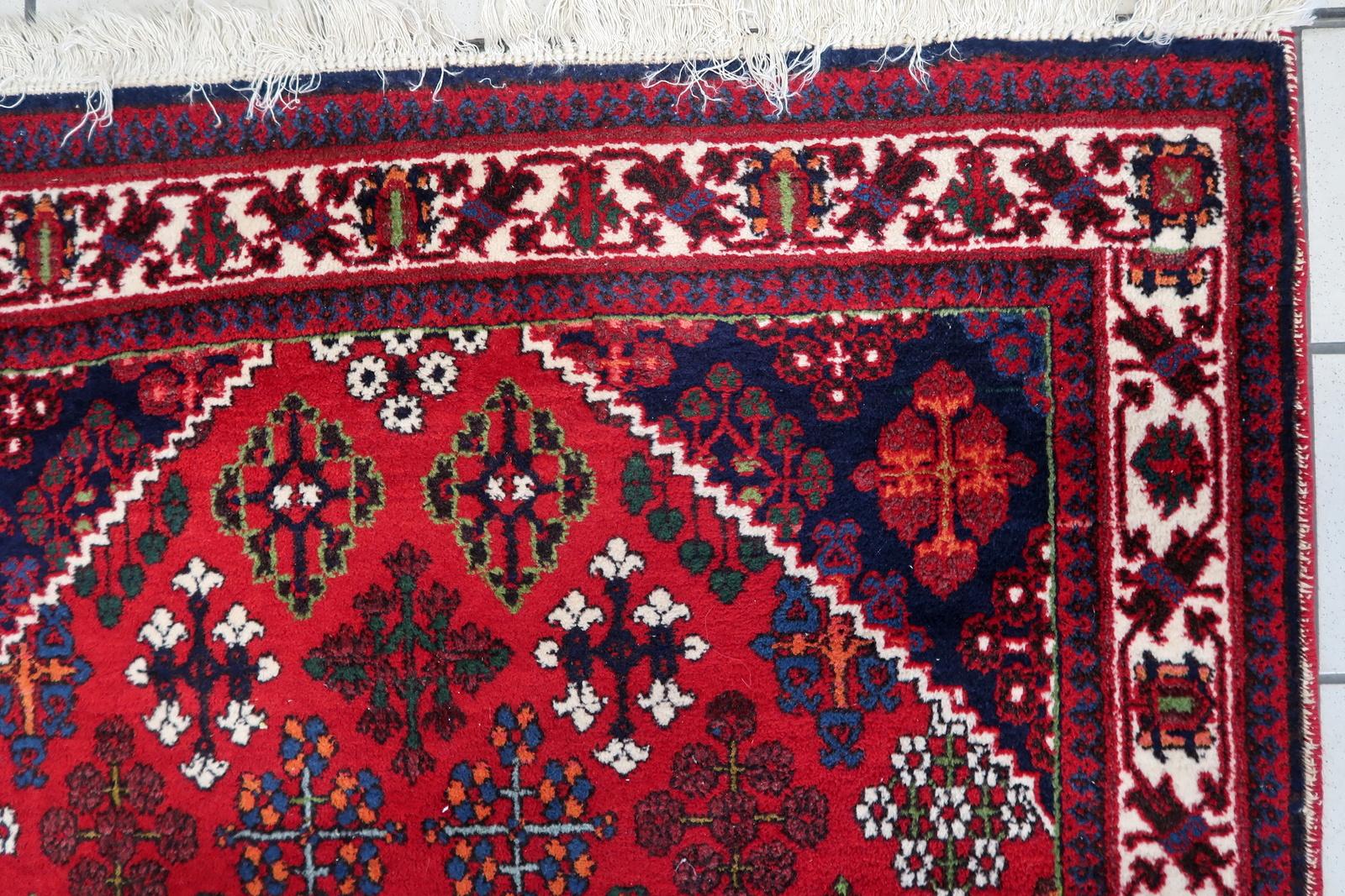 Elevate your space with our Handmade Vintage Uzbek Bukhara Rug, a radiant masterpiece from the 1960s that seamlessly blends tradition with timeless charm. In a striking bright red hue, this rug adds a burst of color and warmth to your home.

Crafted
