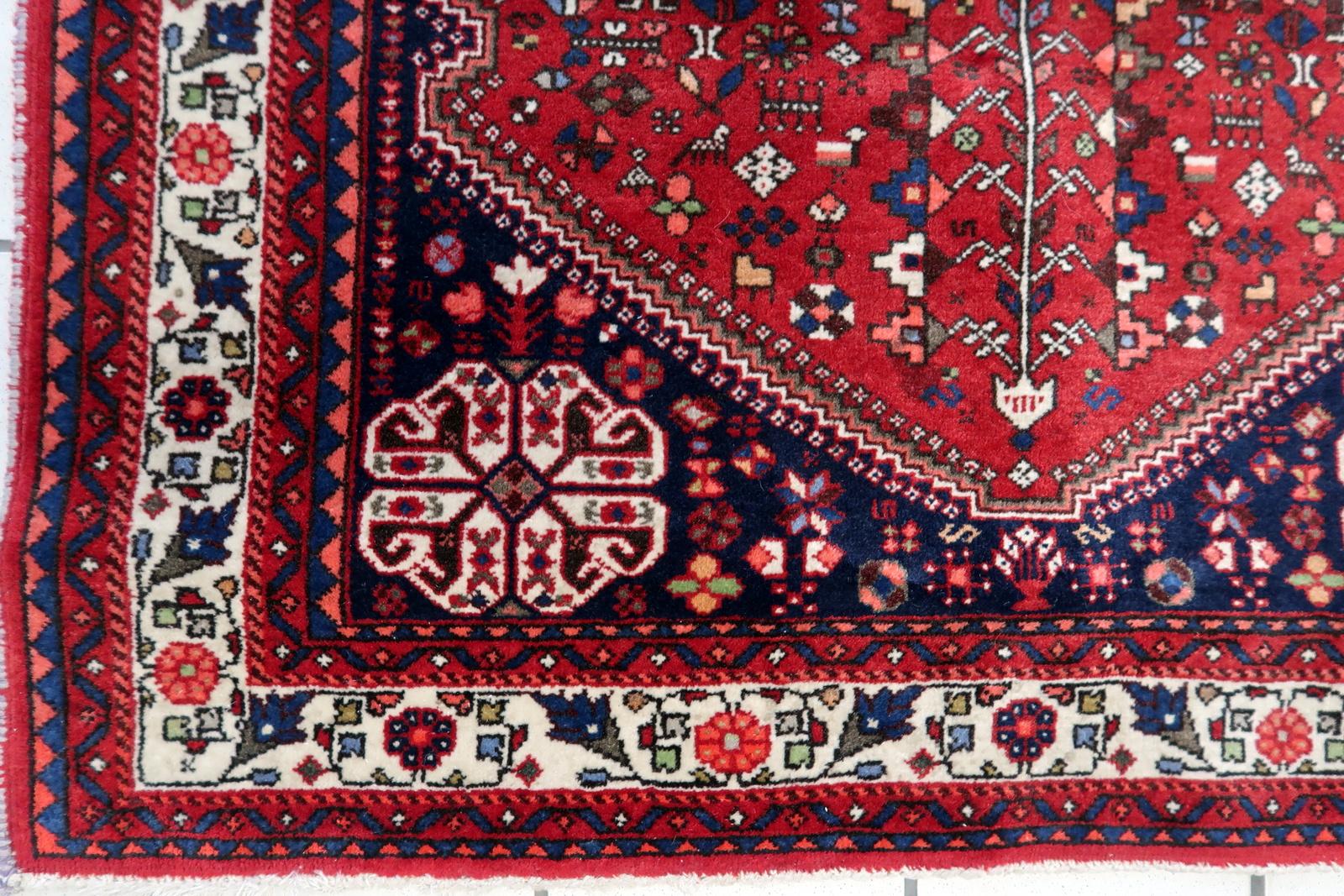 Elevate your space with our Handmade Vintage Persian Malayer Rug, a captivating piece from the 1970s. Measuring at 3.4' x 4.9', this rug boasts a bright red color that adds a pop of vibrancy to any room.

Crafted with care from high-quality wool,