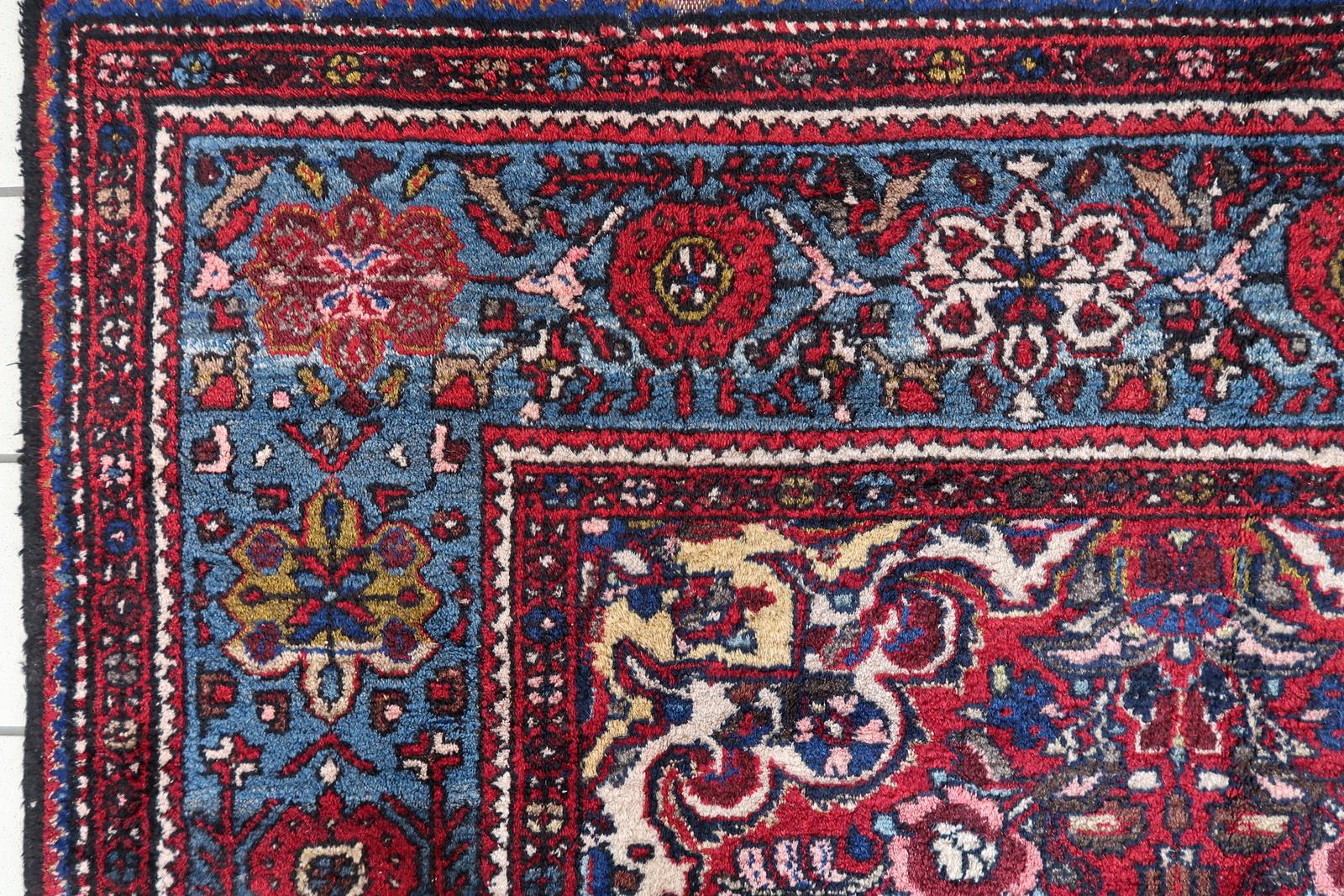 Handmade Vintage Persian Malayer Rug:

Design and Aesthetics:
Originating from the 1960s, this rug carries a rich history and timeless appeal.
Measuring 166cm x 324cm (approximately 5.4’ x 10.6’), it’s a substantial piece that commands