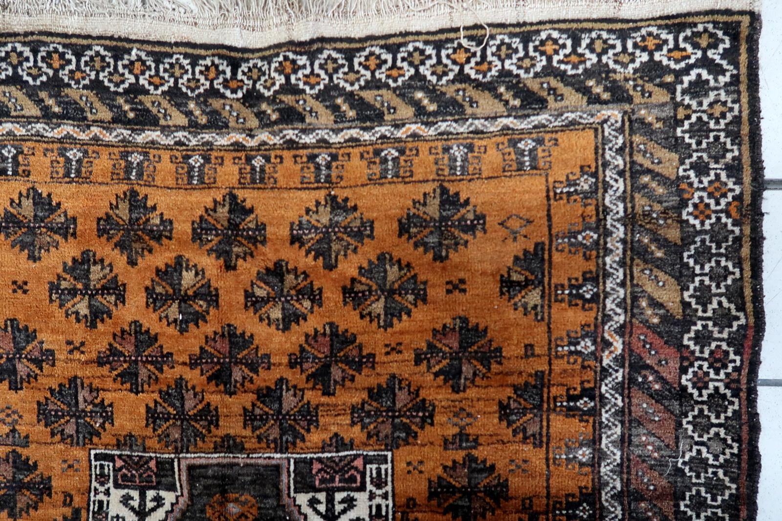 Handmade Antique Afghan Baluch Rug:

Indulge in the timeless allure of our Handmade Antique Afghan Baluch Rug, meticulously crafted in the 1920s. Measuring 3.5’ x 6.2’ (107cm x 189cm), this versatile piece is a testament to Afghan Baluch weavers'