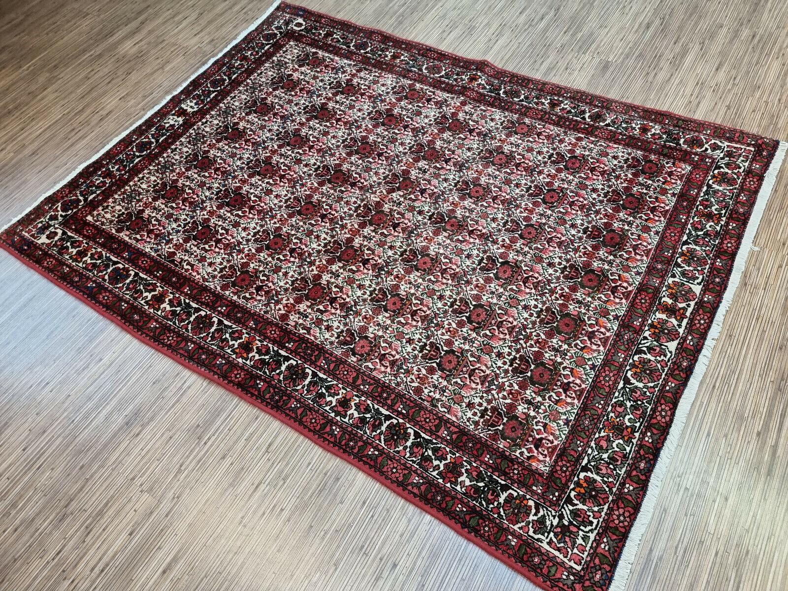 Add a touch of elegance and history to your home with our Handmade Vintage Persian Style Afshar Rug. This stunning piece was made in the 1950s, measuring 4.9’ x 6.5’ or 150cm x 200cm, ideal for medium-sized spaces.

The rug showcases a sophisticated