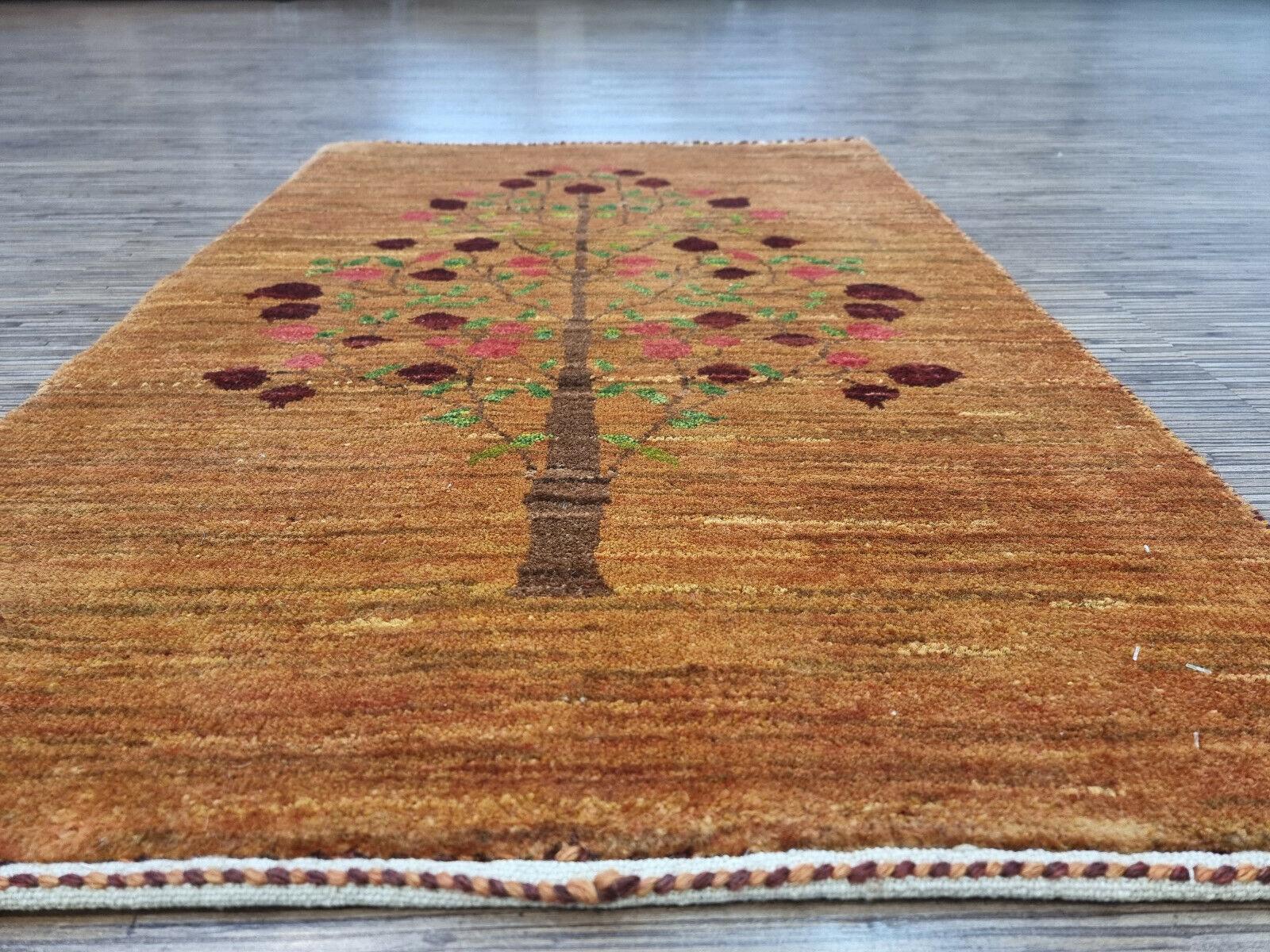 Step into a world of comfort and style with this exquisite Handmade Vintage Persian Style Gabbeh Rug. Crafted meticulously from high-quality wool, this rug is in good condition, promising durability and a soft touch underfoot.

Colors &