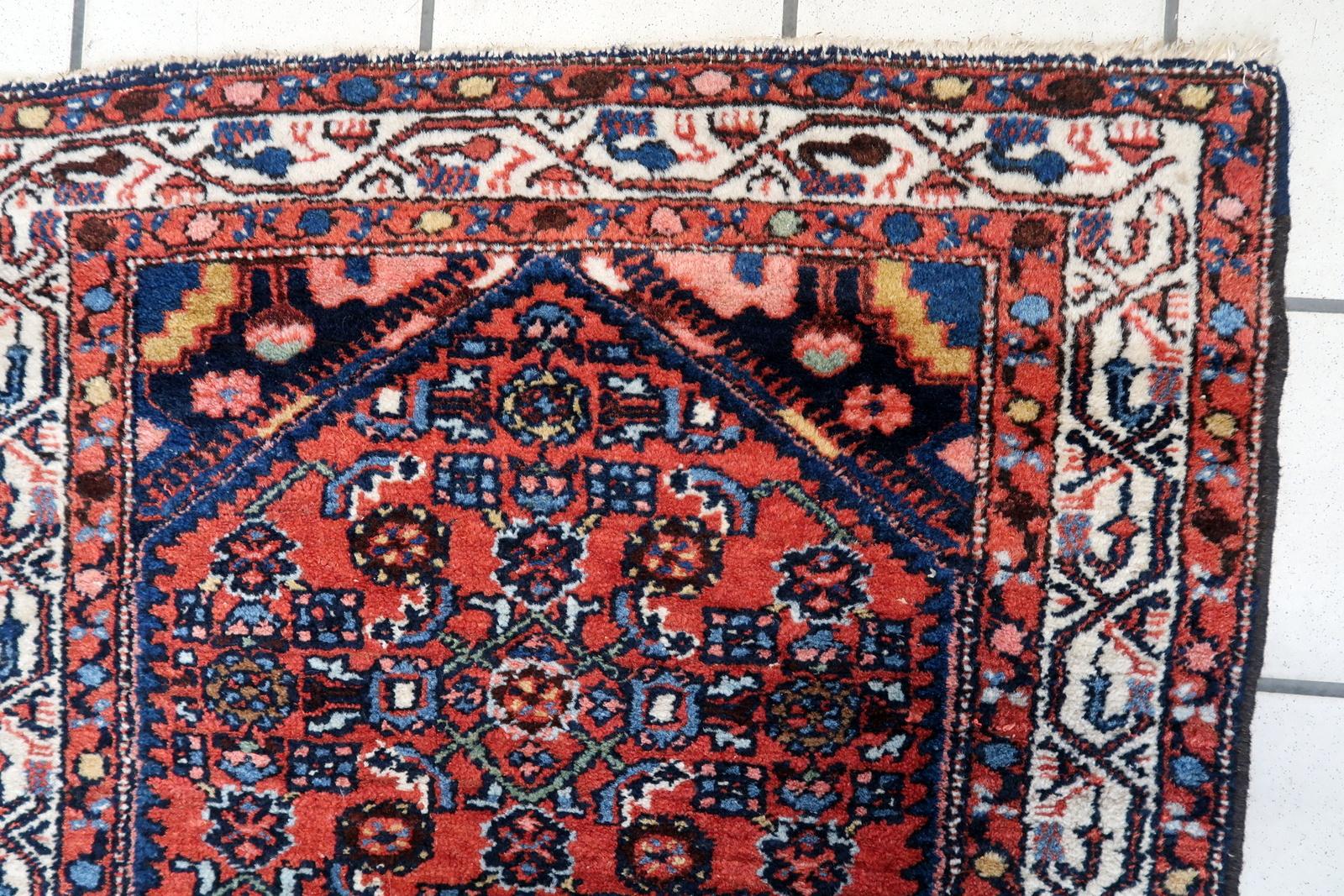 Handmade Vintage Persian Style Hamadan Rug:

Dimensions: This meticulously crafted rug measures 2.4’ x 4.1’ (76cm x 126cm), making it suitable for smaller spaces or as an accent piece.
Craftsmanship: Originating from the 1970s, this rug reflects the