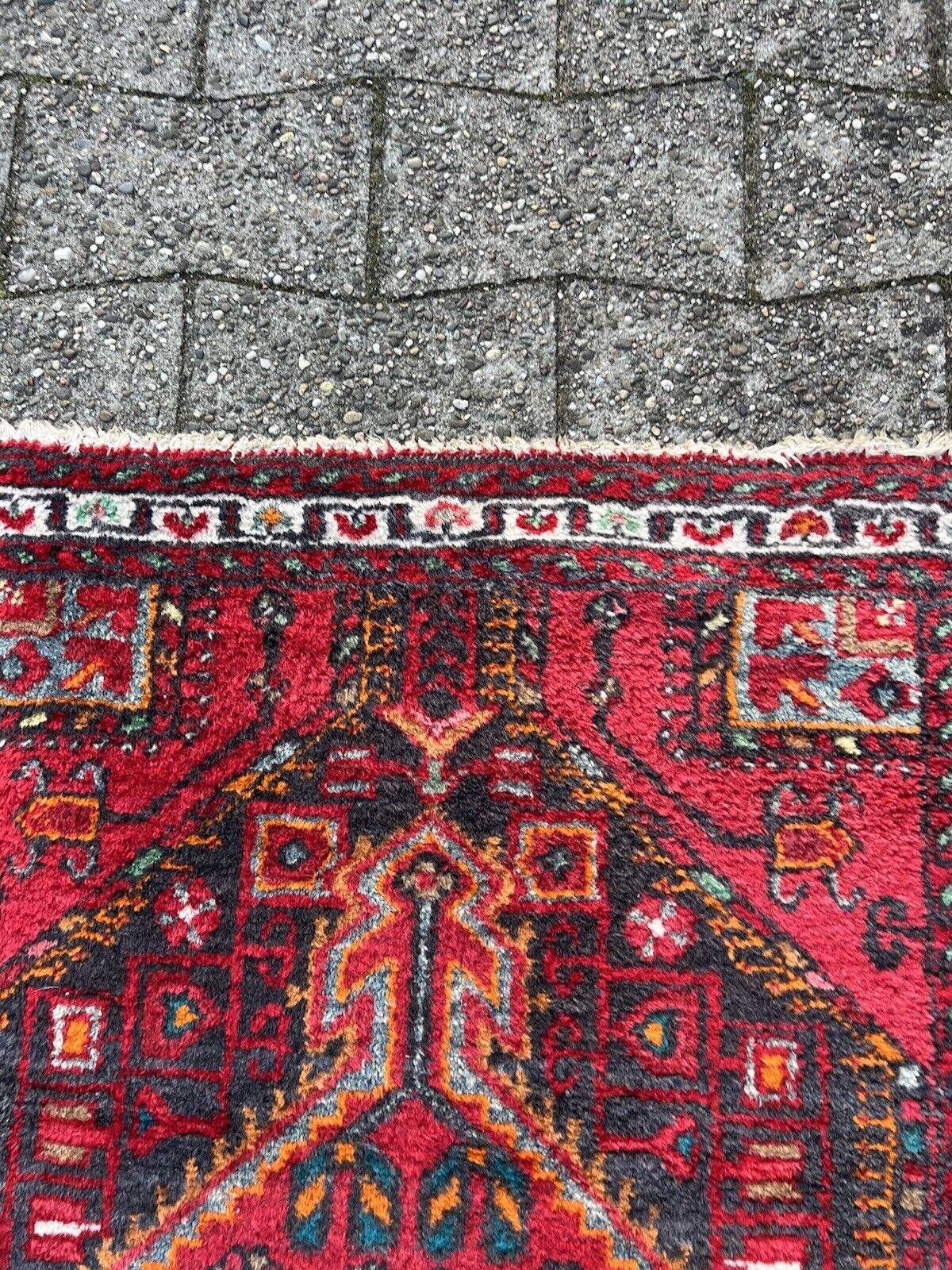 Handmade Vintage Persian Style Hamadan Rug
Overview:
Step into the splendor of our Handmade Vintage Persian Style Hamadan Rug, a testament to rich tradition and enduring craftsmanship. This authentic piece, dating back to the 1970s, exudes timeless