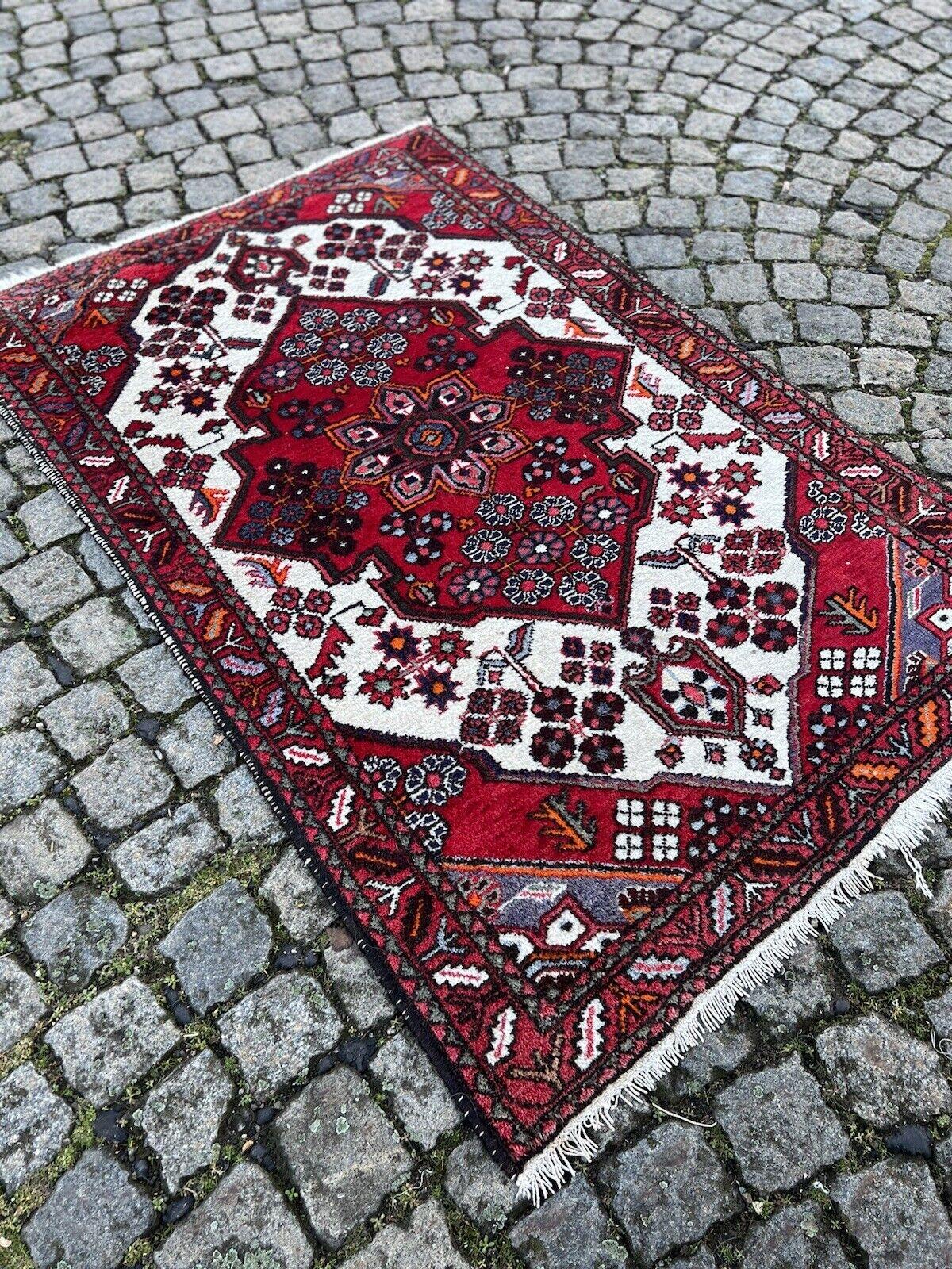Handmade Vintage Persian Style Hamadan Rug

Add a touch of timeless elegance and classic artistry to your home with this handmade vintage Persian style Hamadan rug. Crafted in the 1970s from quality wool, this rug features intricate geometric and