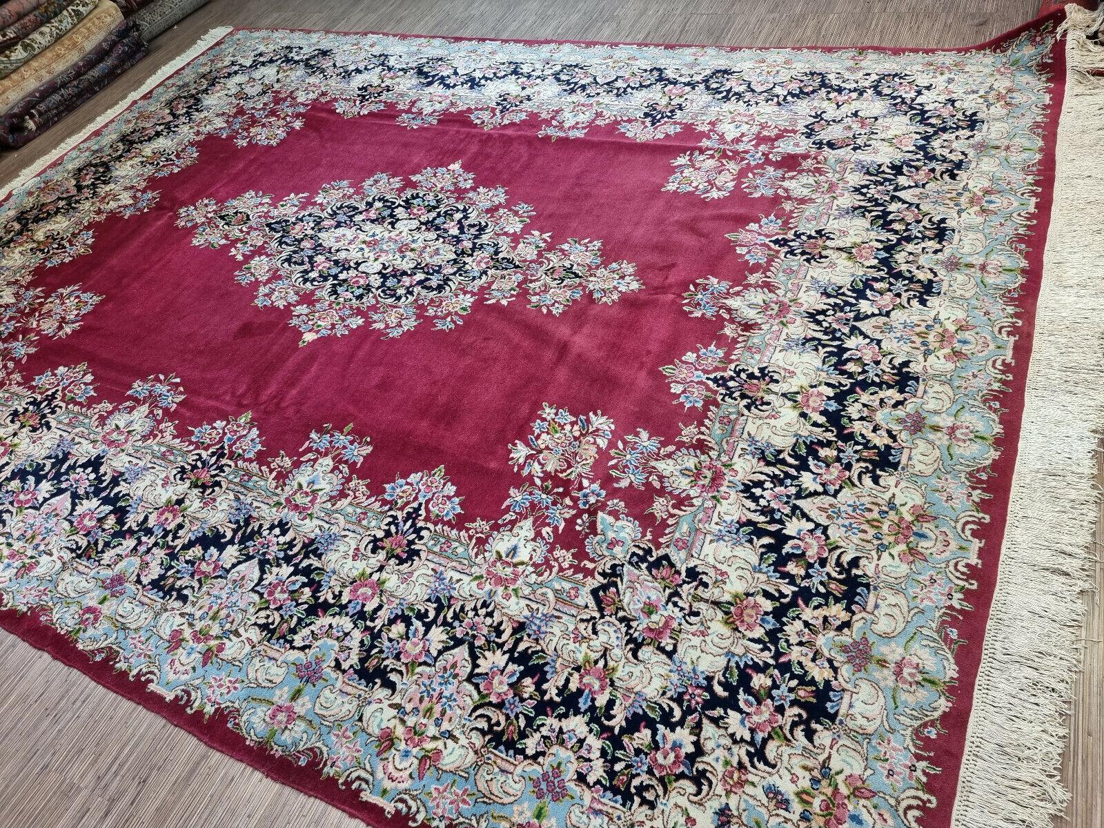 Add a touch of luxury and elegance to your home with this Handmade Vintage Persian Style Kerman Rug, a magnificent piece of art that showcases the finest craftsmanship of the 1970s. This wool rug measures 10.1' x 13.1' (310cm x 400cm) and is in good