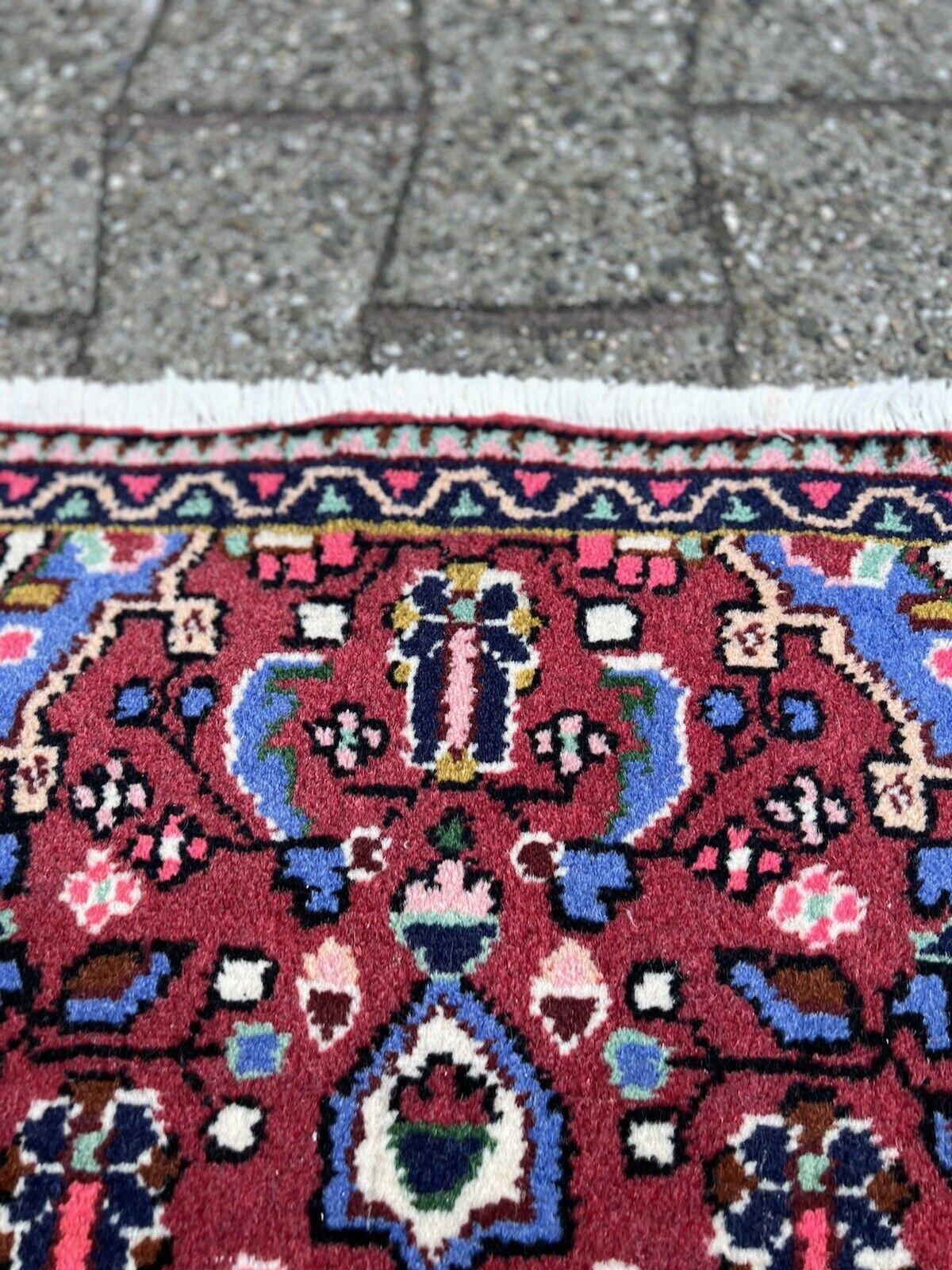 Add a splash of color to your space with this Handmade Vintage Persian Style Lilihan Rug. Dating back to the 1970s, this small rug measures 1.8’ x 2.9’ (55cm x 91cm) and is a vibrant showcase of traditional Persian craftsmanship.

The rug is made