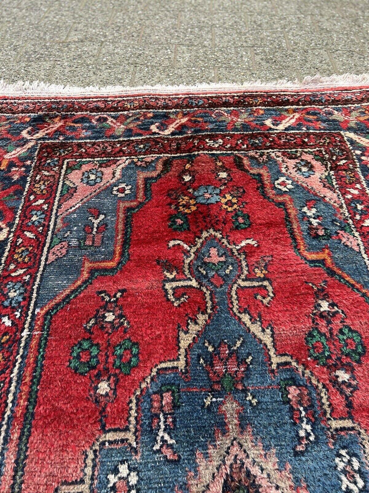 Step back in time with this Handmade Vintage Persian Style Lilihan Rug. Originating from the 1970s, this rug measures 3.8’ x 7’ (117cm x 216cm) and is a stunning representation of Lilihan rug-making artistry.

The rug is in good condition, with some