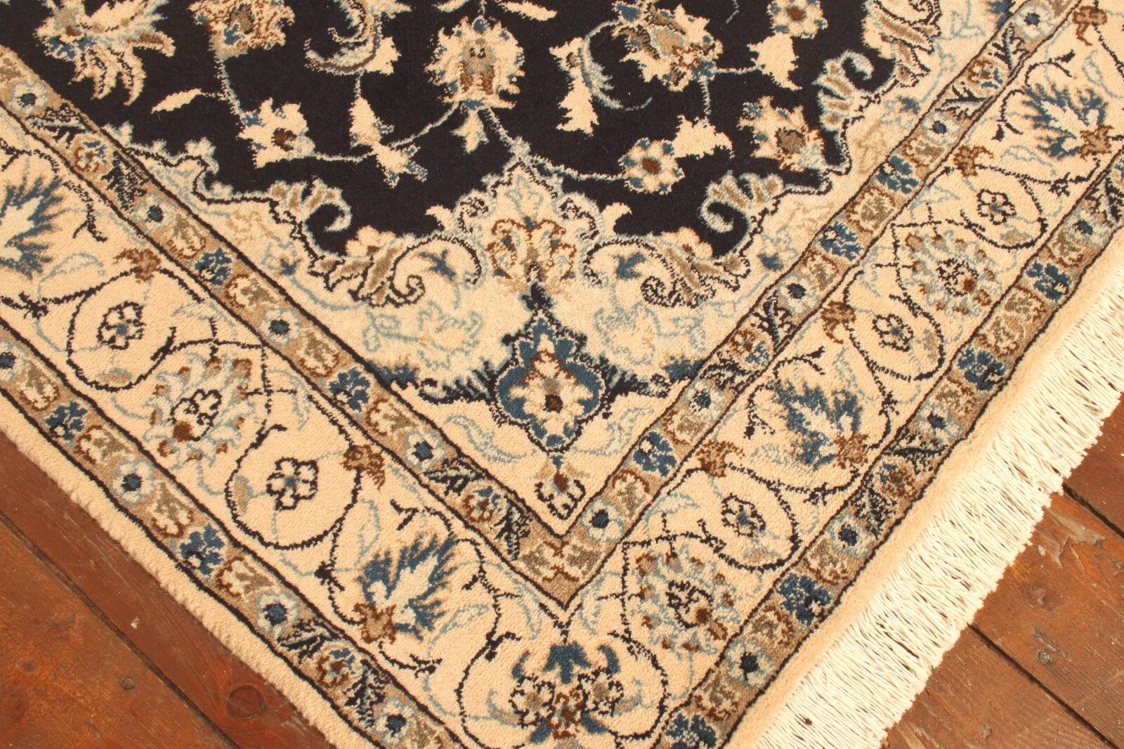 Handmade Vintage Persian Style Nain Rug (3.9’ x 6.6’ / 120cm x 202cm)

Step into the elegance of Persian craftsmanship with our Handmade Vintage Persian Style Nain Rug. Originating from the 1980s, this woolen rug measures 3.9’ x 6.6’ (120cm x