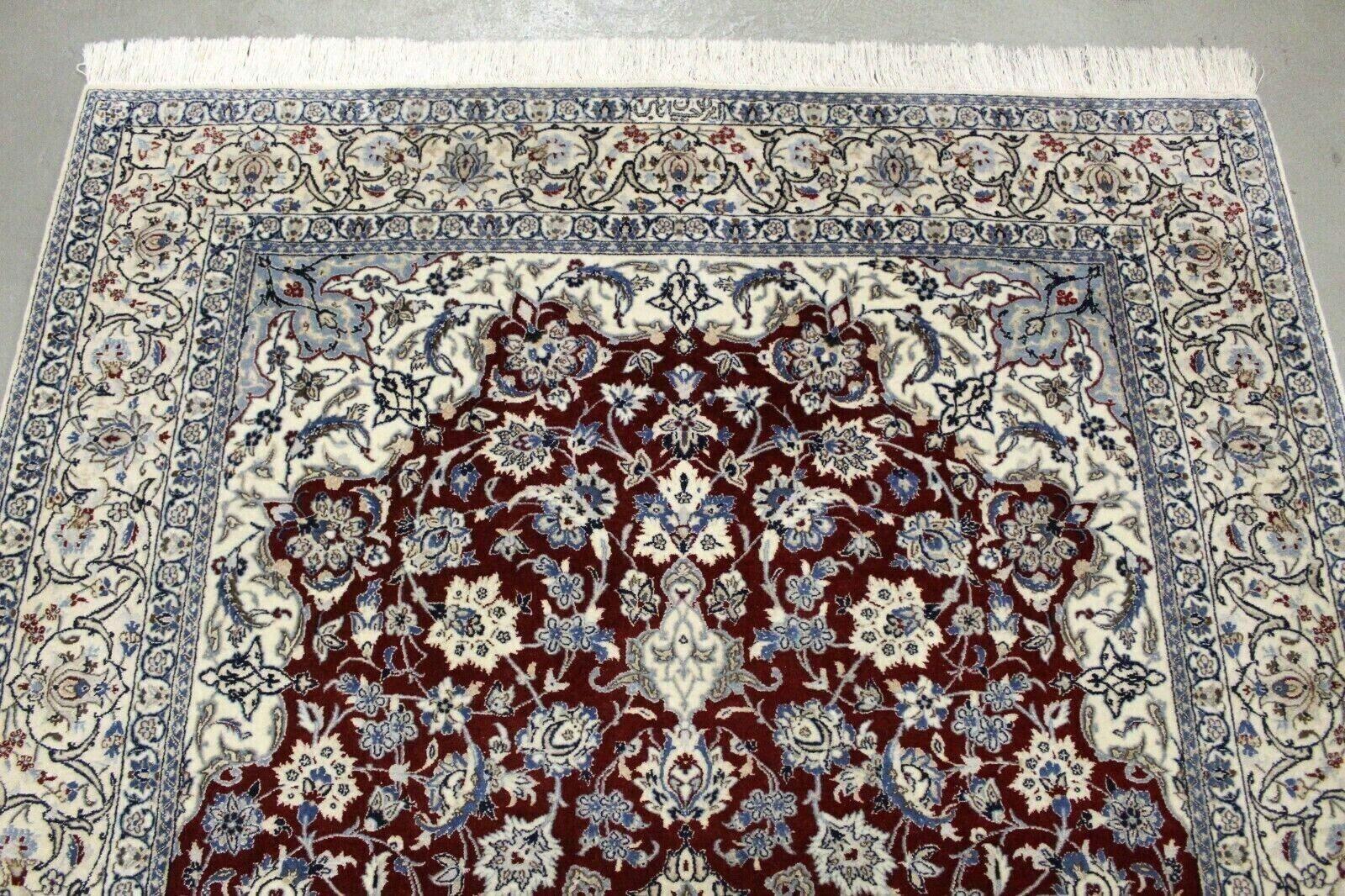 Introducing our exquisite Handmade Vintage Persian Style Nain Rug, a captivating piece that brings timeless elegance to any space. Measuring approximately 4.1’ x 6.3’ (126cm x 193cm), this rug from the 1970s is meticulously crafted from the finest