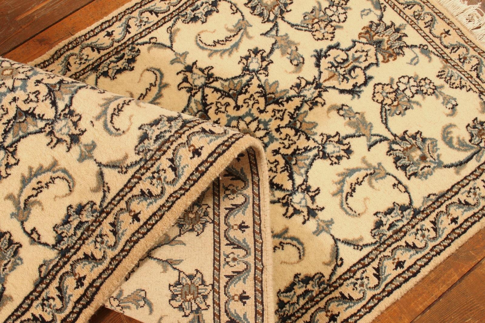 Handmade Vintage Persian Style Nain Runner Rug (2.5’ x 6.3’ / 77cm x 193cm)

Enhance your home with the classic elegance of our Handmade Vintage Persian Style Nain Runner Rug. Dating back to the 1980s, this woolen runner rug measures 2.5’ x 6.3’