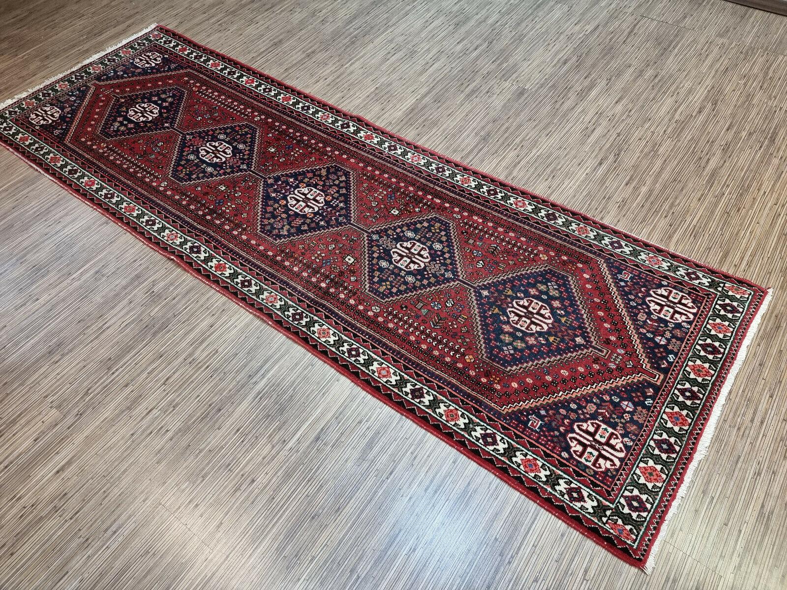 Enhance your home with our Handmade Vintage Persian Style Shiraz Rug, a magnificent piece of art and history. This rug was made in the 1960s, measuring 3.1’ x 9.2’, ideal for long and narrow spaces.

The rug features a stunning design, with four