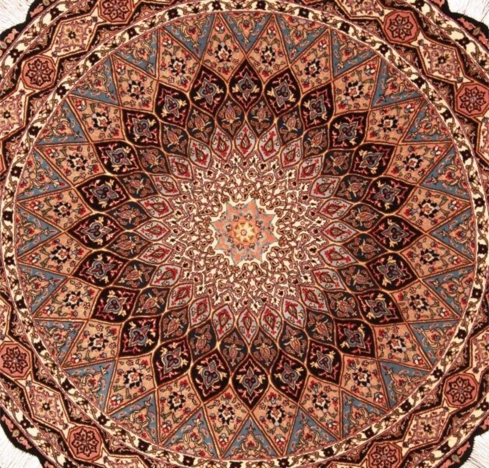 Handmade Vintage Persian Style Tabriz 50 Raj Rug

Dimensions: 4.9’ diameter (approximately 150 cm diameter)
Material: Wool with Silk Highlights
Era: 1970s
Condition: Good

Behold the splendor of this round Tabriz 50 Raj rug, a handcrafted