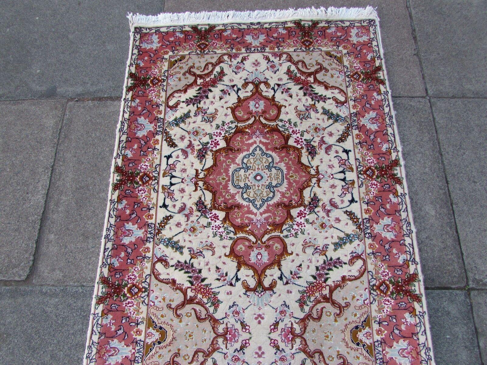 Elevate your home decor with the timeless elegance of this Handmade Vintage Persian Style Tabriz Runner Silk Rug. It's more than a runner; it's a masterpiece that encapsulates the intricate artistry of Persian rugs.

Key Features:

Artistry in Every