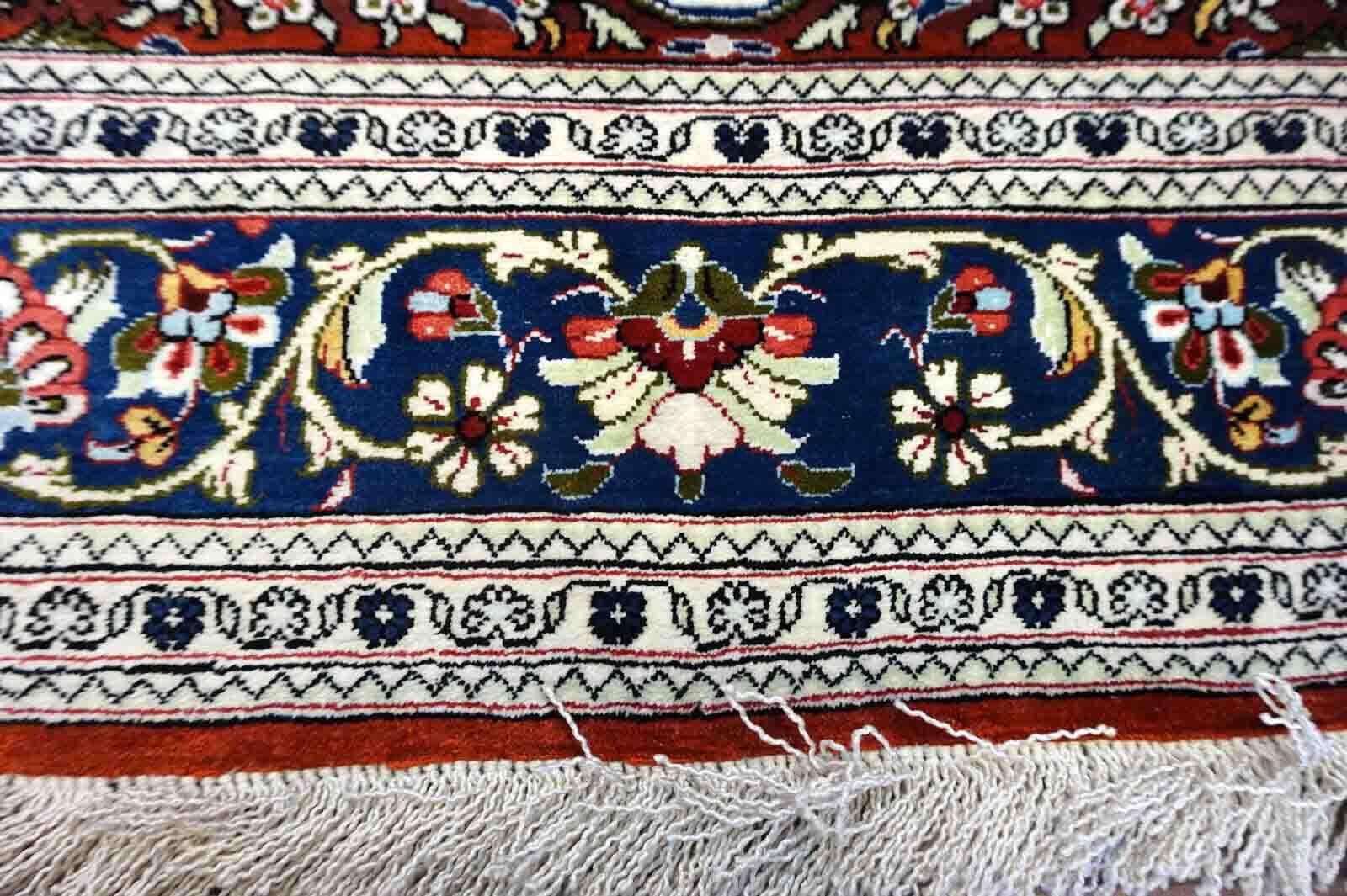 Handmade vintage Qum rug in very busy floral design with natural colors. The rug has been made in silk. It is is from the end of 20th century in original good condition.

-condition: original good,

-circa: 1970s,

-size: 2.5' x 4' (79cm x