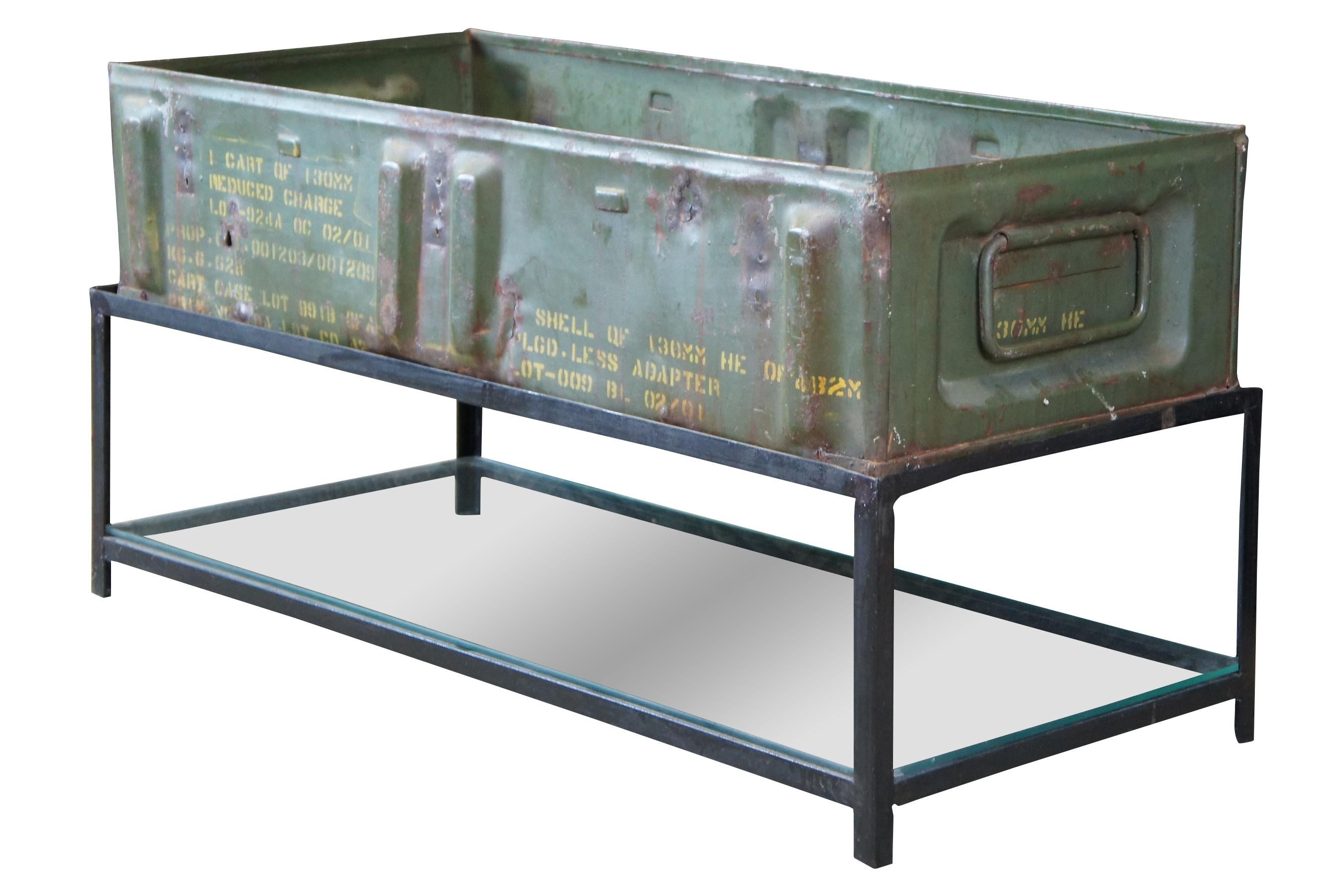 A steel ammo box on handmade steel stand with glass shelve. A versatile piece that can be used for storage or as a coffee table. Add a glass top to use as a console or sofa table.

Measures: 38
