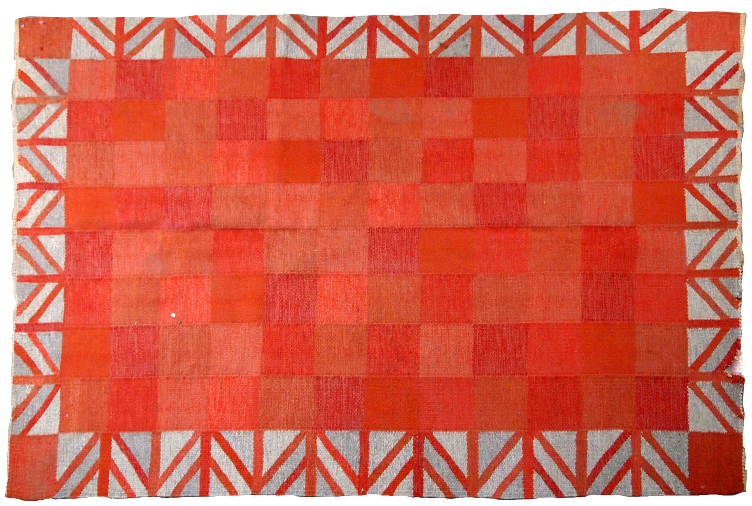 Scandinavian flat-weave Kilim from the middle of 20th century in good condition. Squared pattern in different shads of red.
 