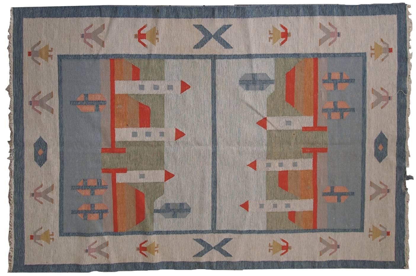Vintage Scandinavian Kilim in original good condition. Light shade of blue combines well with white, green and bright red colors. This Kilim made out of wool.
 