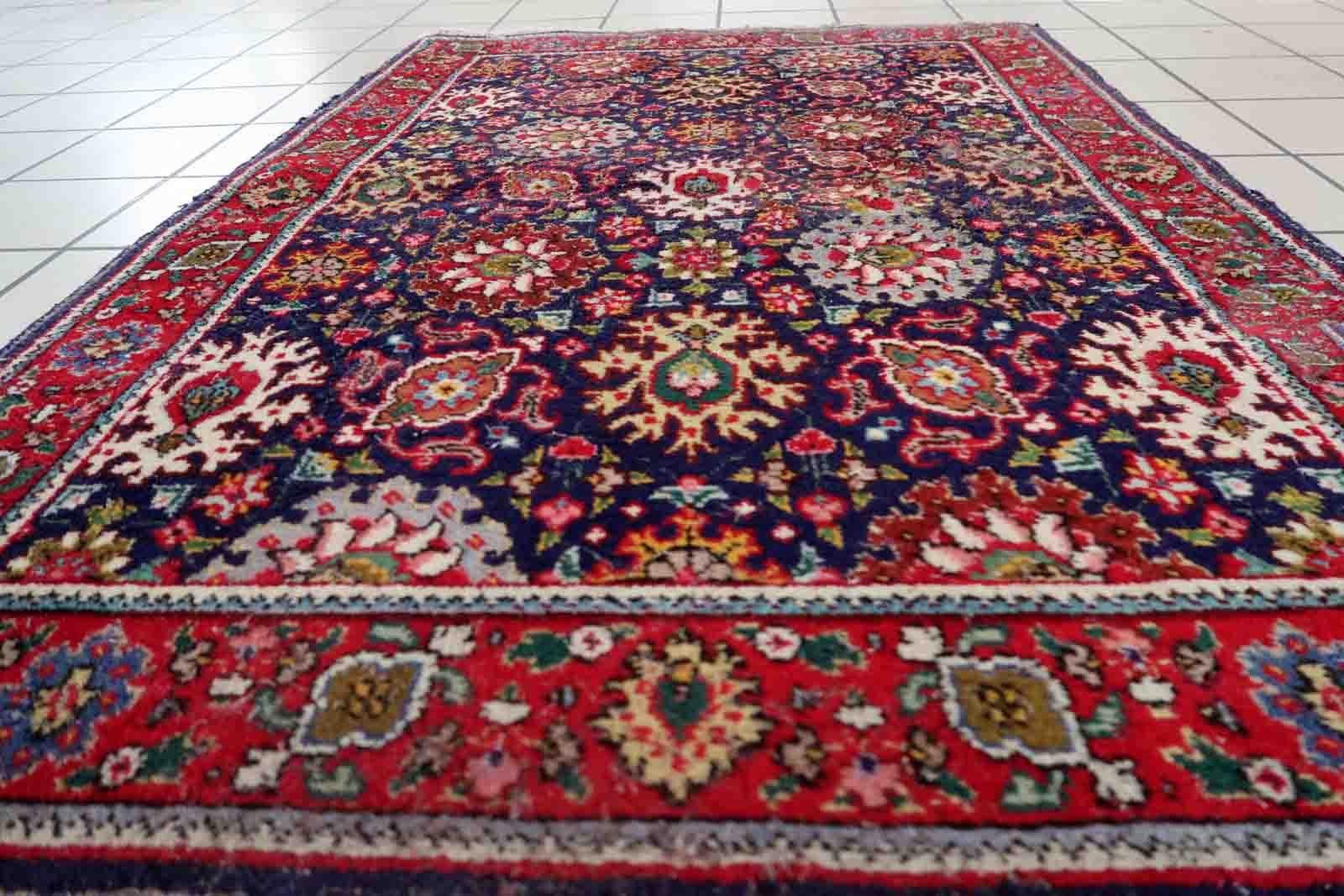 Handmade vintage Tabriz rug in floral design and unusual purple background. The rug is from the middle of 20th century in good condition, it has some old restorations.

-condition: good, some old restorations,

-circa: 1950s,

-size: 3.3' x