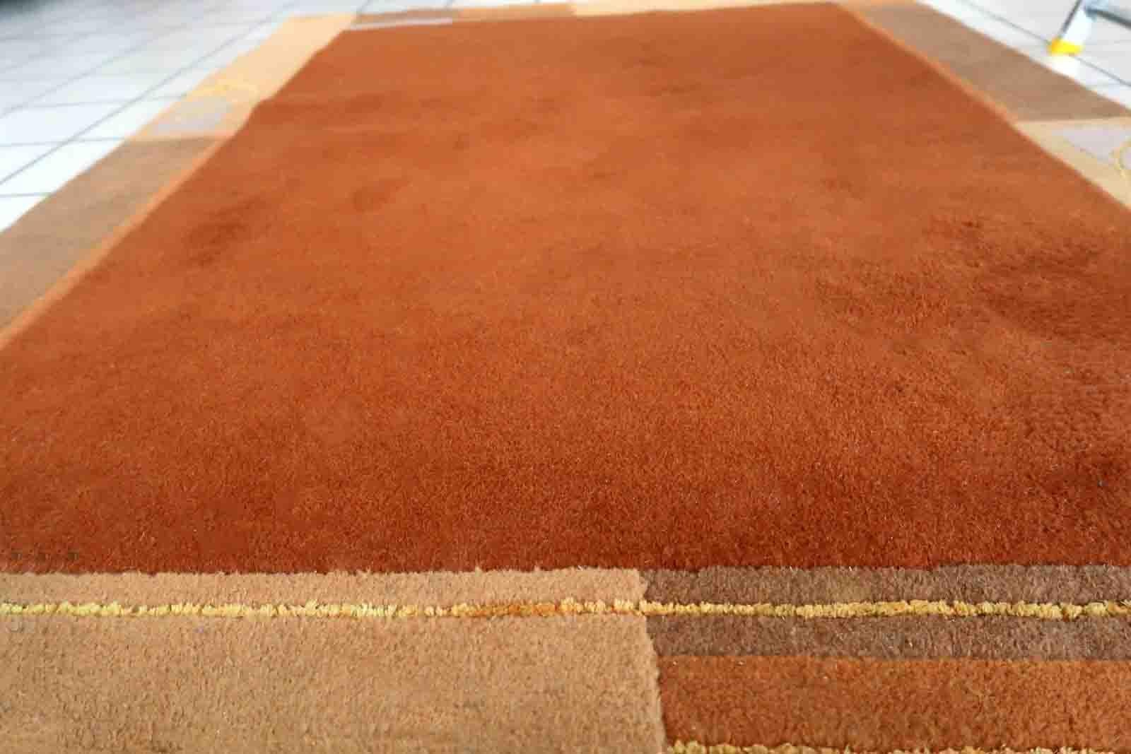 Handmade vintage Tibetan Khaden rug in different shades of brown and beige colors. The rug is from the end of 20th century, it is in original good condition. 

-condition: original good,

-circa: 1970s,

-size: 4' x 5.3' (122cm x