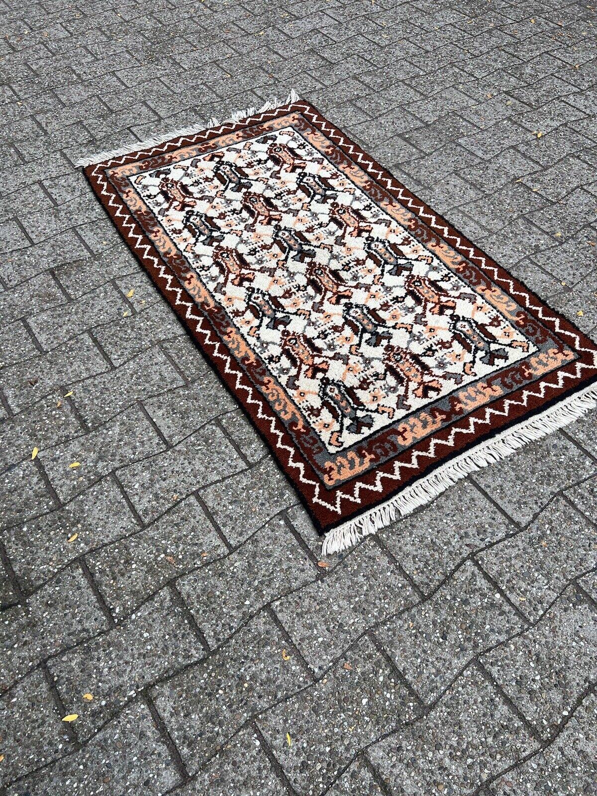 Step into the world of North African artistry with this Handmade Vintage Tunisian Berber Rug. Crafted in the 1970s, this rug measures 2.7’ x 4.9’ (83cm x 151cm) and is a beautiful representation of Berber cultural heritage.

The rug is in good