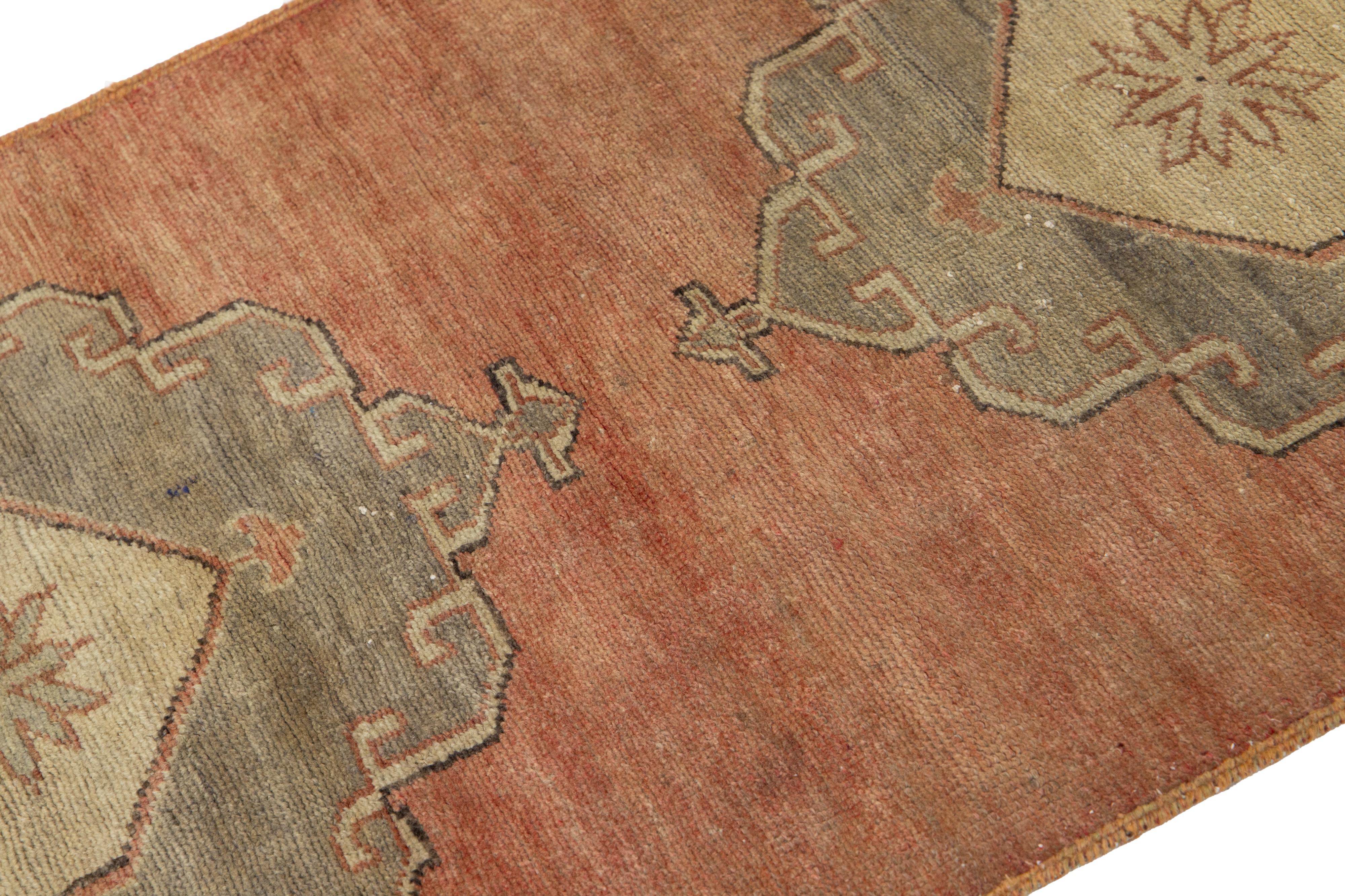 Hand-Knotted Handmade Vintage Turkish Anatolian Wool Runner In Terracotta with Tribal Motif For Sale