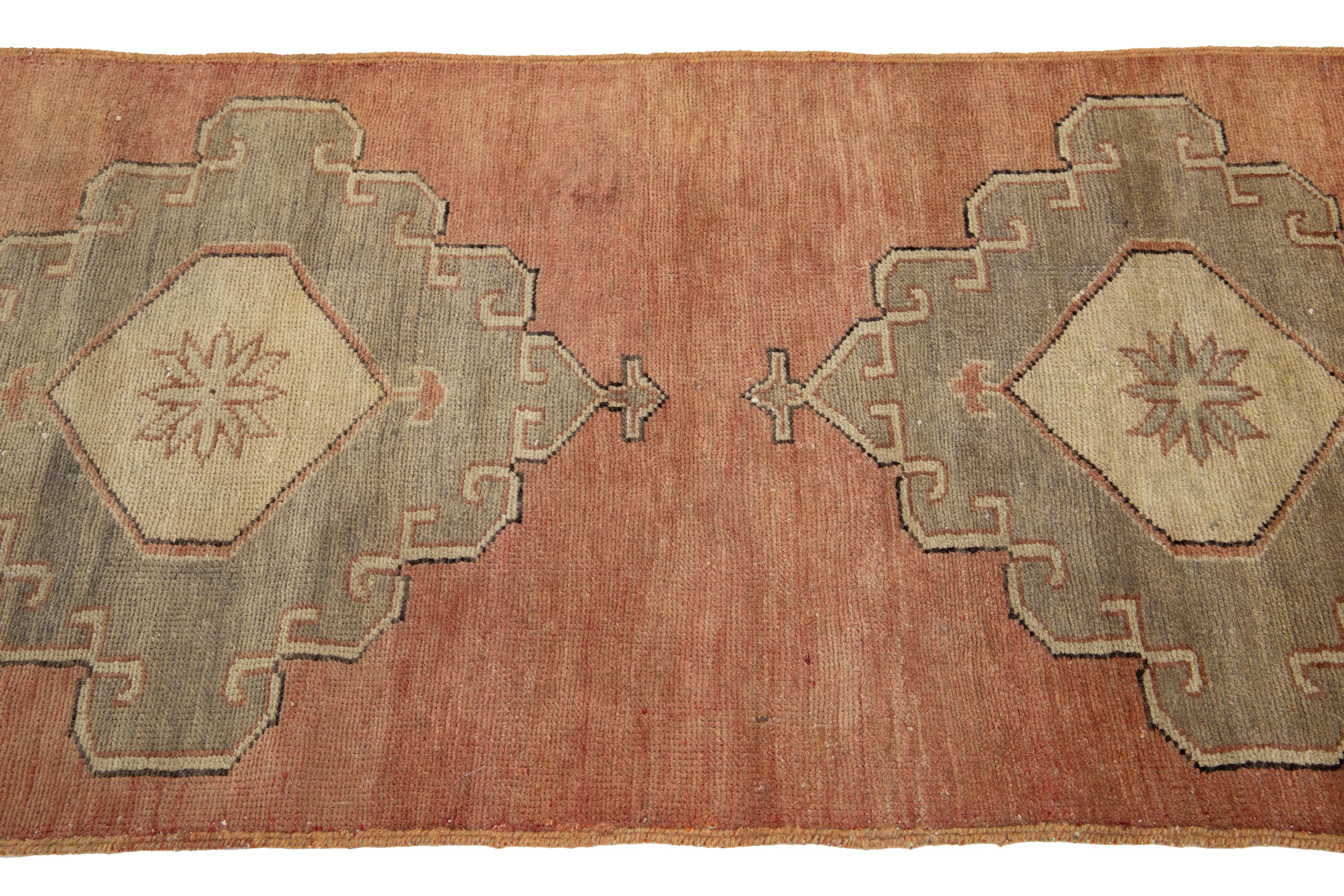 20th Century Handmade Vintage Turkish Anatolian Wool Runner In Terracotta with Tribal Motif For Sale
