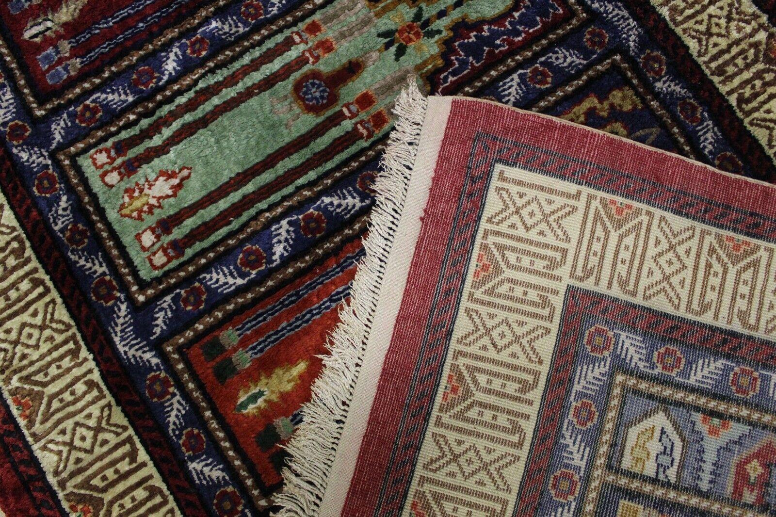 Elevate your decor with our Handmade Vintage Turkish Keyseri Silk Rug from the 1970s. Measuring 2.8' x 7', this rug is a masterpiece of artistry and craftsmanship, showcasing the intricate beauty of Turkish rug-making.

Featuring a vibrant and