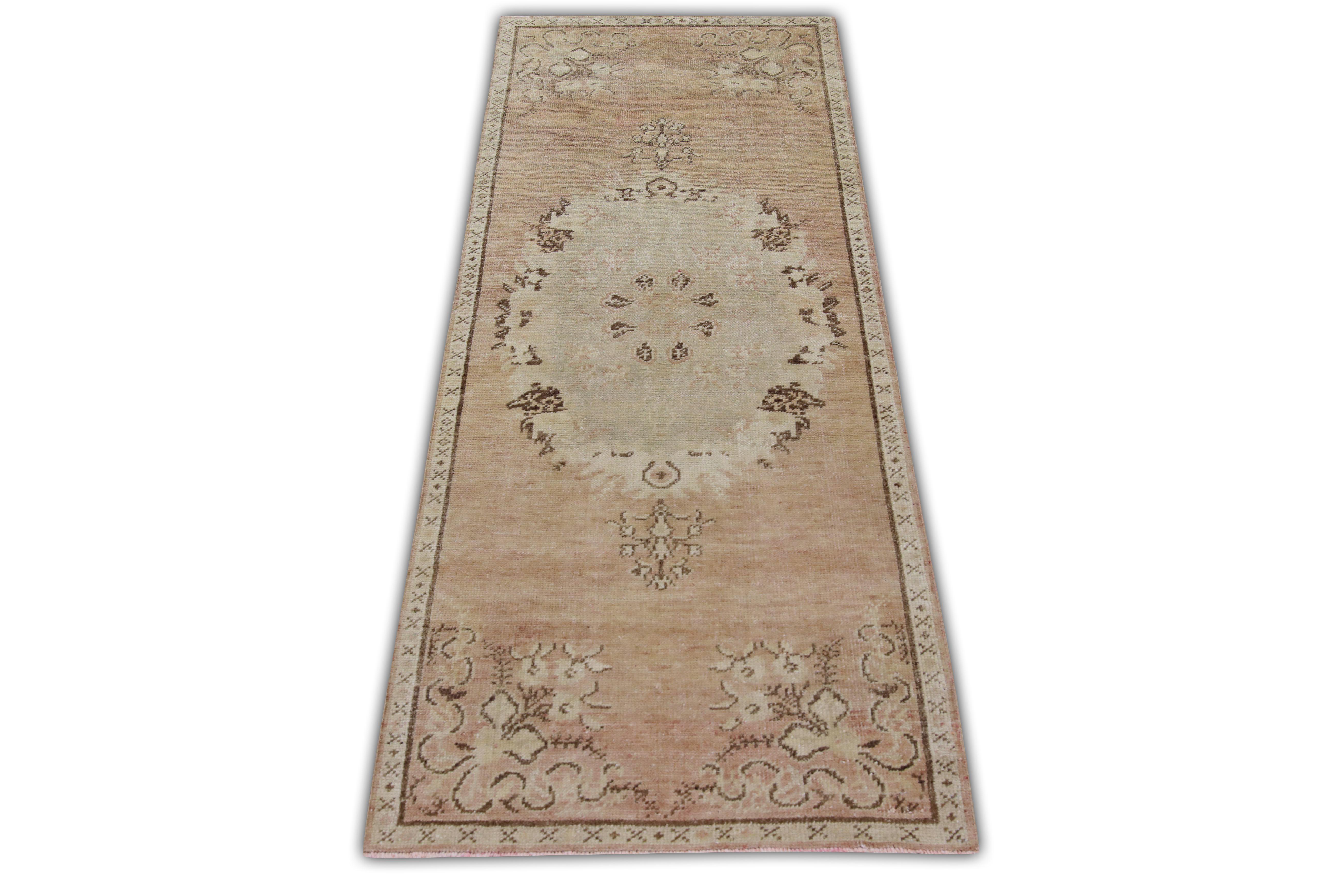 Introducing a one-of-a-kind vintage Turkish hand-knotted wool rug, carefully crafted by skilled artisans using traditional techniques passed down through generations. This exquisite rug boasts a stunning array of natural dyes, resulting in a rich