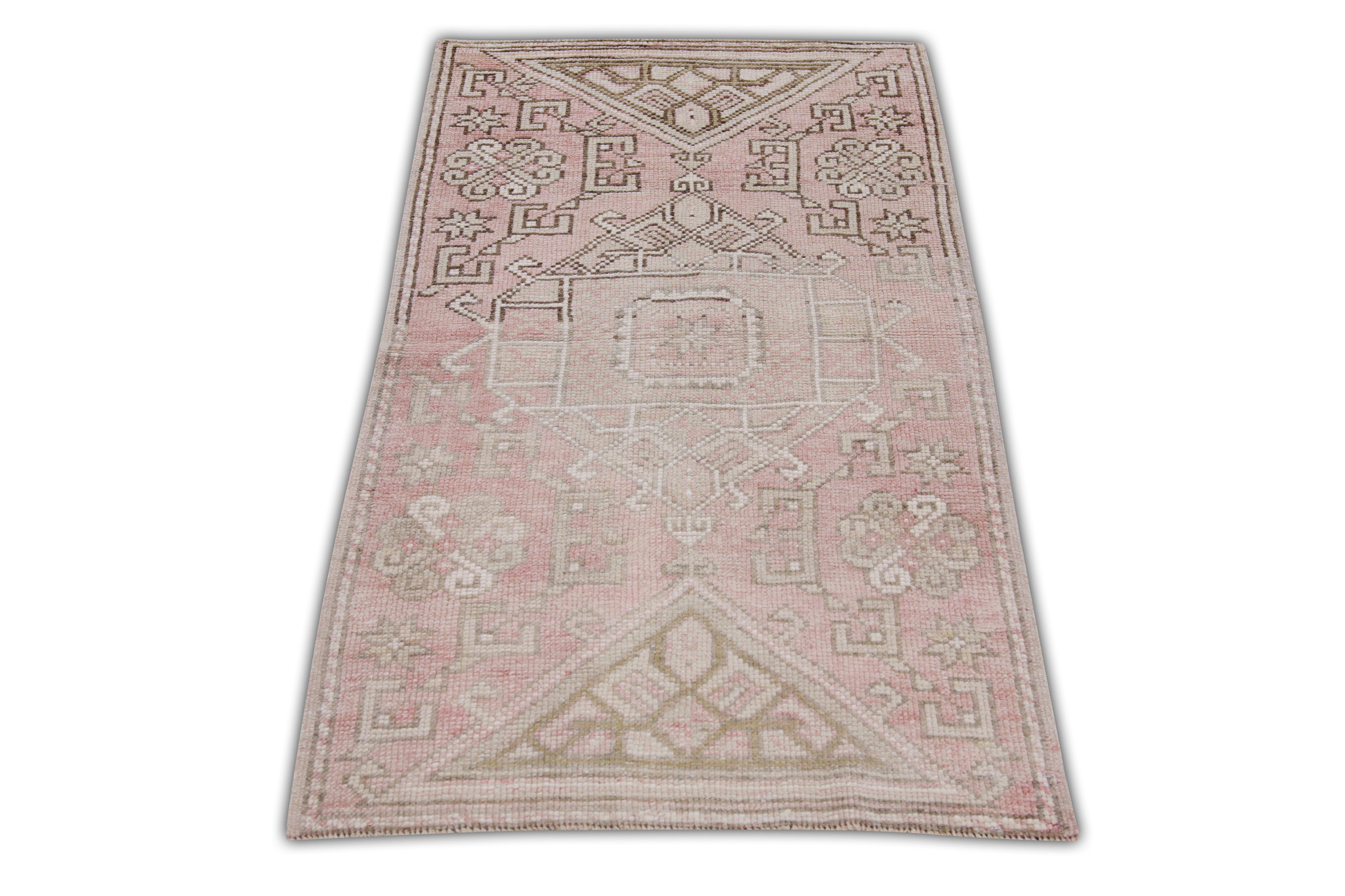 Introducing a one-of-a-kind vintage Turkish hand-knotted wool rug, carefully crafted by skilled artisans using traditional techniques passed down through generations. This exquisite rug boasts a stunning array of natural dyes, resulting in a rich