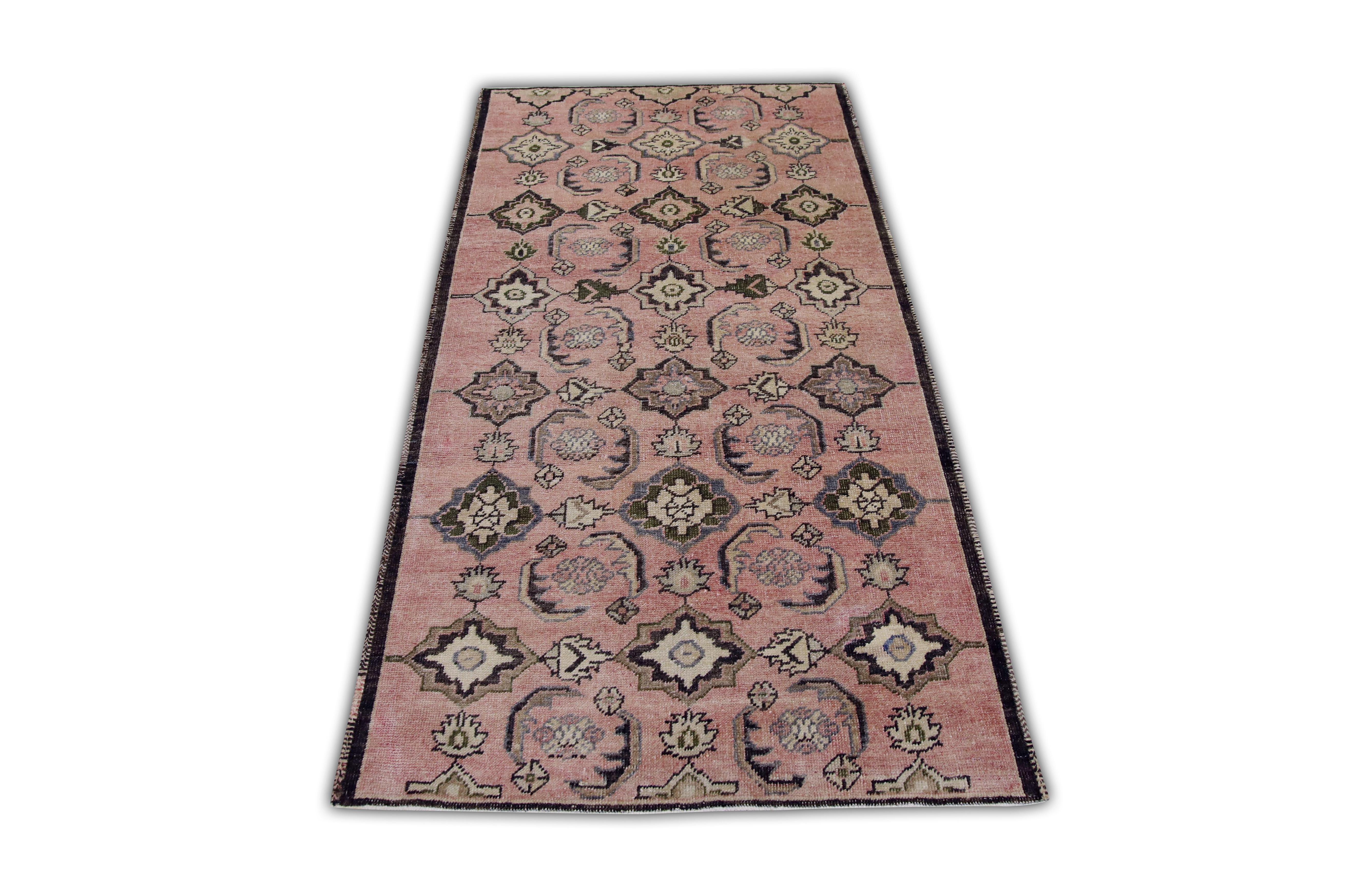 Introducing a one-of-a-kind vintage Turkish hand-knotted wool rug, carefully crafted by skilled artisans using traditional techniques passed down through generations. This exquisite rug boasts a stunning array of natural dyes, resulting in a rich