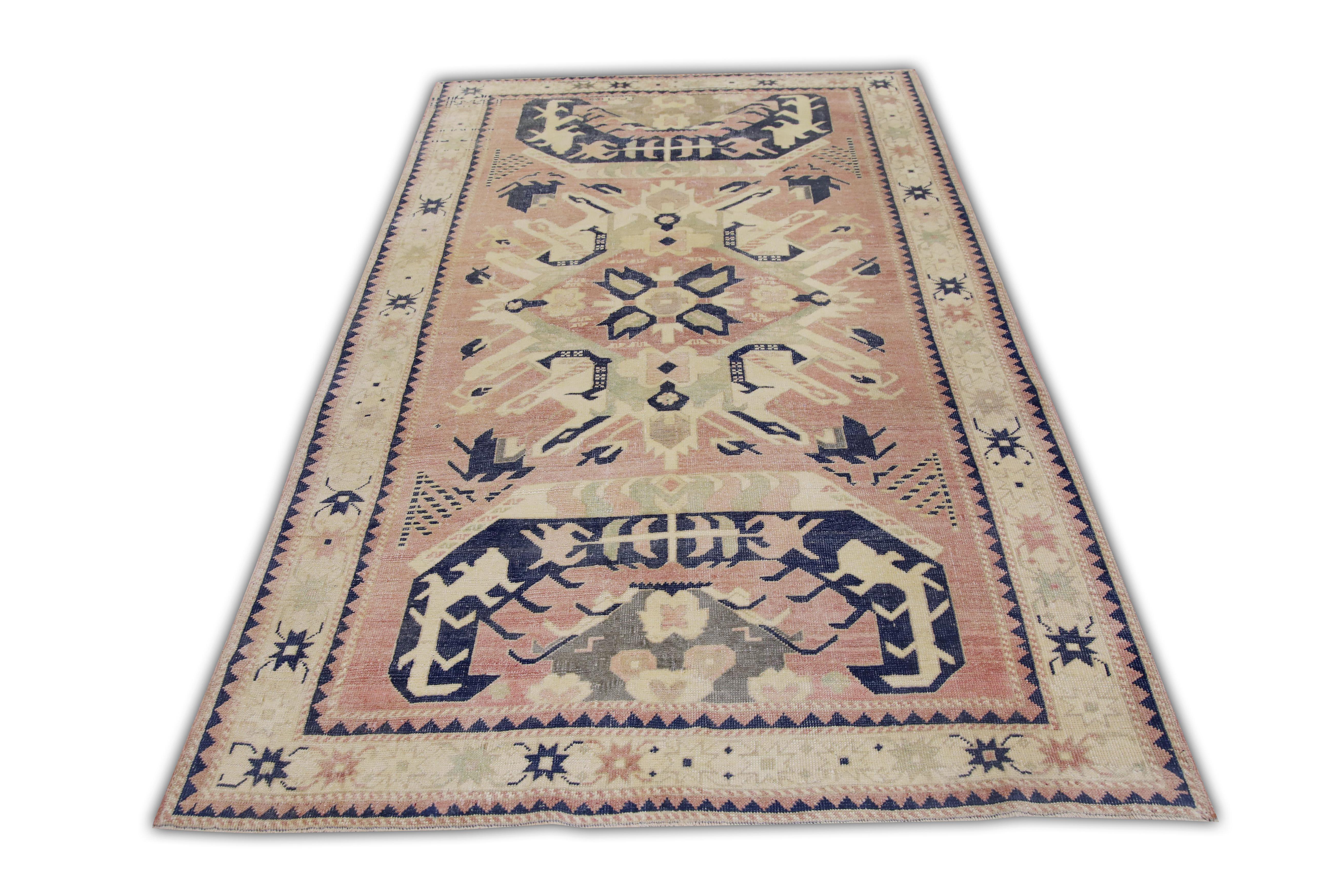 Introducing a one-of-a-kind vintage Turkish hand-knotted wool rug, carefully crafted by skilled artisans using traditional techniques passed down through generations. This exquisite rug boasts a stunning array of natural dyes, resulting in a rich