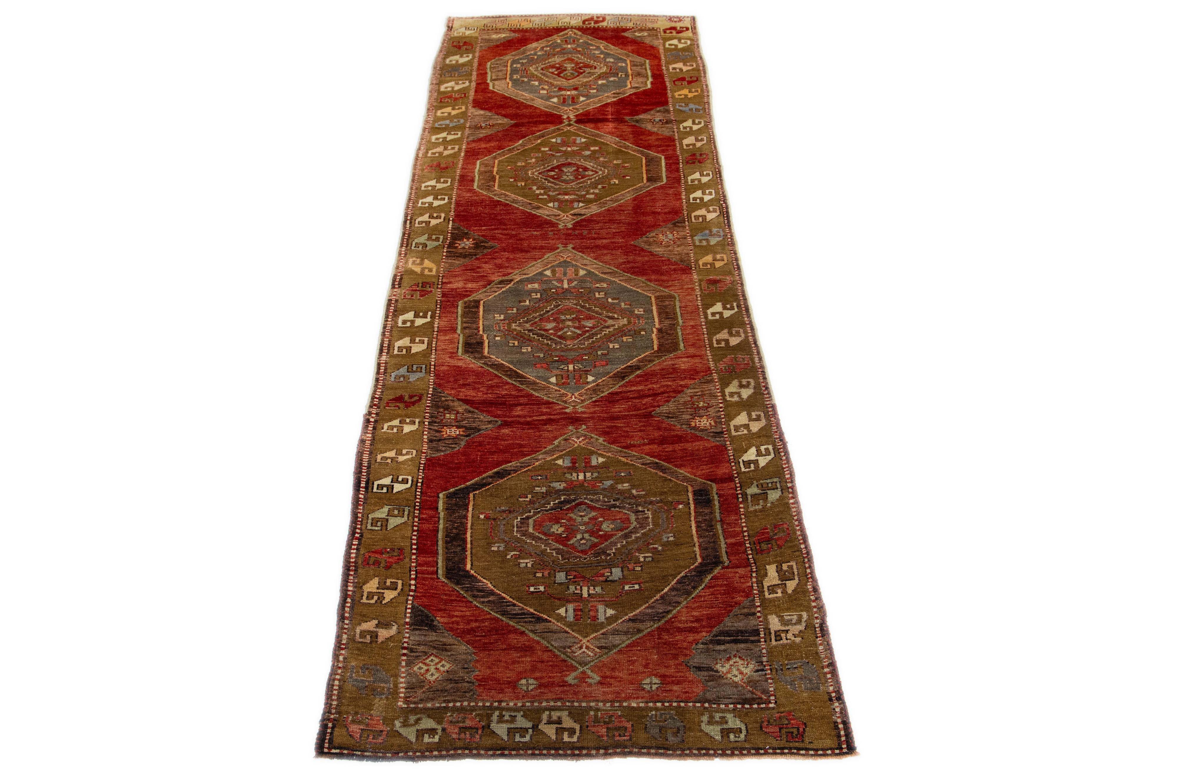 Beautiful vintage Karajah hand-knotted Wool rug with a rust color field. This Kalajah rug has multi-color accents in a gorgeous all-over geometric design.

This rug measures 3'8