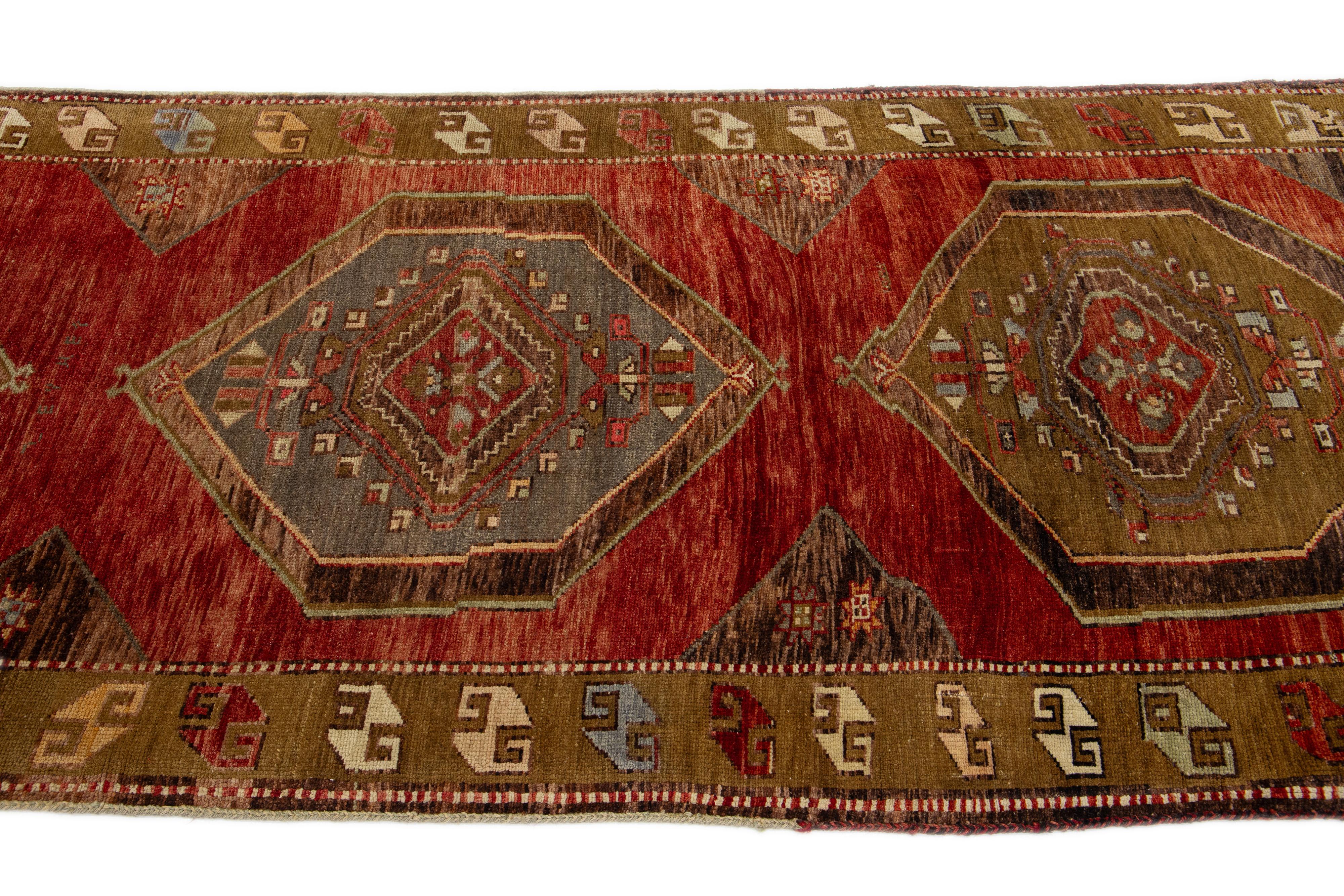 Persian Handmade Vintage Turkish Wool Runner with Tribal Pattern For Sale