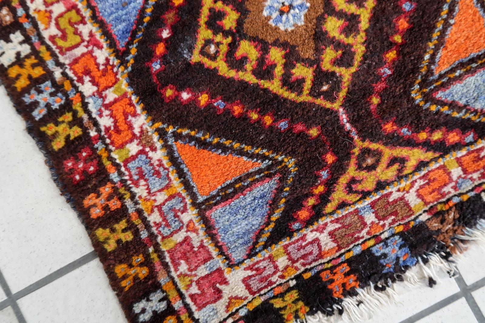 Condition: This rug is in its original good condition, retaining its beauty and charm through the years.
Circa: Crafted around the 1950s, it's a testament to the enduring artistry of Turkish rug-making.

Size: Measuring 1.7' x 2.6' (54cm x 80cm),