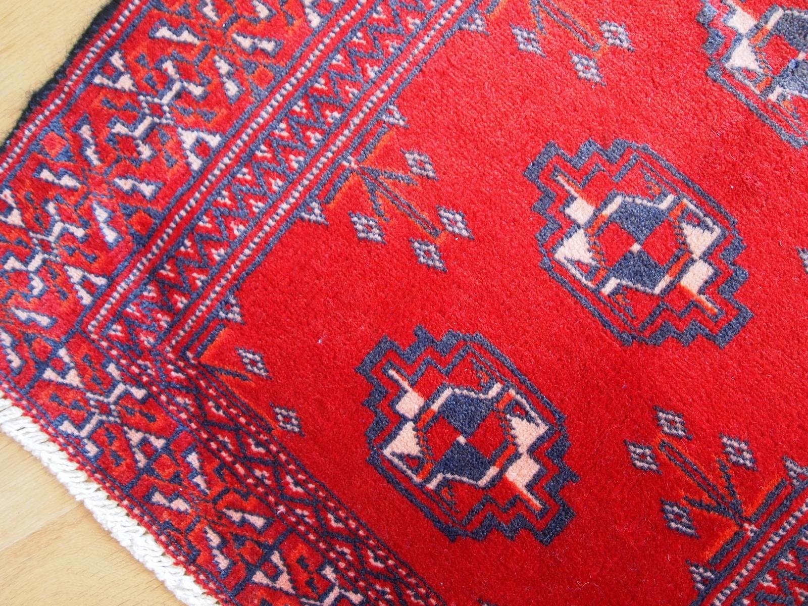 Hand made vintage Turkoman rug in bright red field and purple design. Very classic tribal design and refreshing beautiful colors. Pile of wool has short cut but in good original condition.


-Condition: original good,

-Circa: 1970,

-Size: