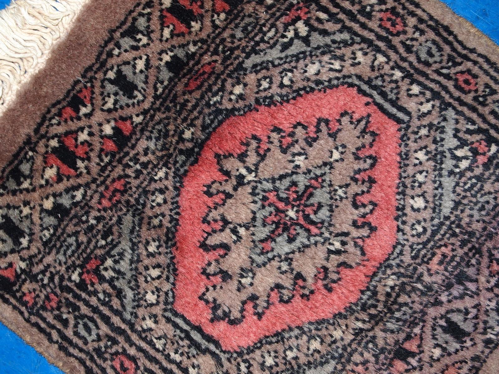 Vintage handmade Uzbek Bukhara praying mat in original good condition. The rug is from the end of 20th century.

-condition: origial good, 

-circa: 1960s,

-size: 1' x 1' (31cm x 33cm),

-material: wool,

-country of origin: